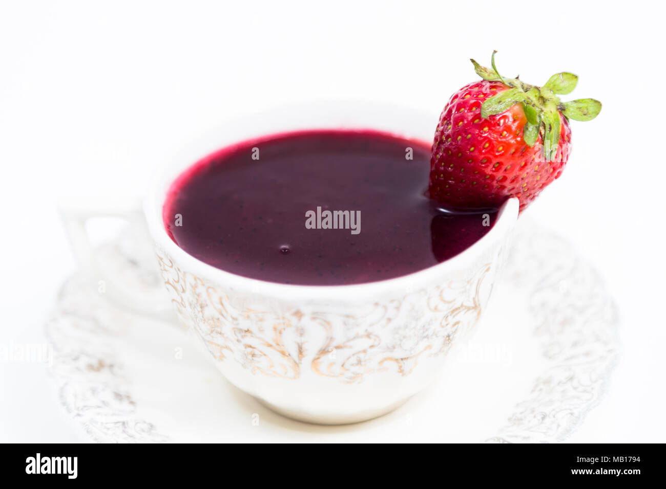 Cup with "Colada Morada" purple wash; traditional Ecuadorian drink