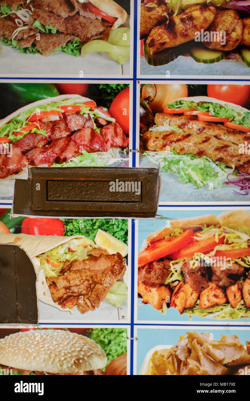 Door furniture including letterbox detail with fast food background