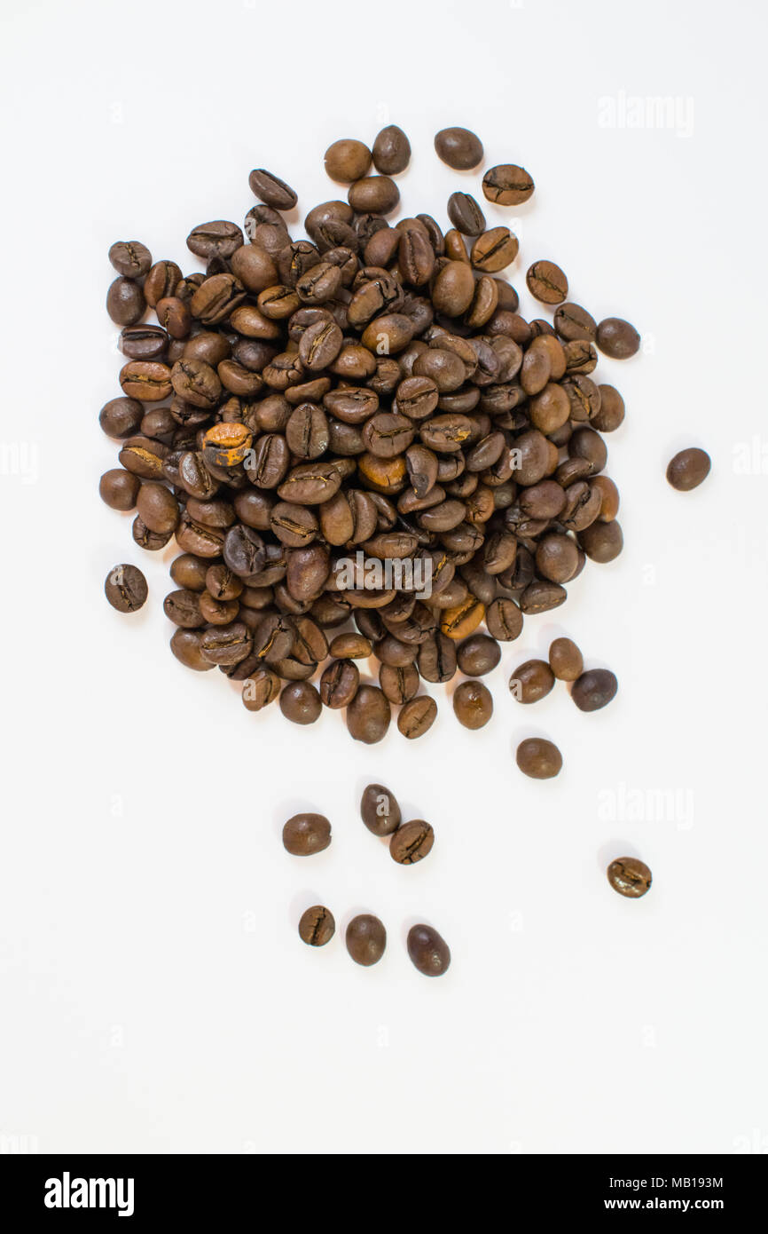 pile of coffee beans on white background Stock Photo - Alamy