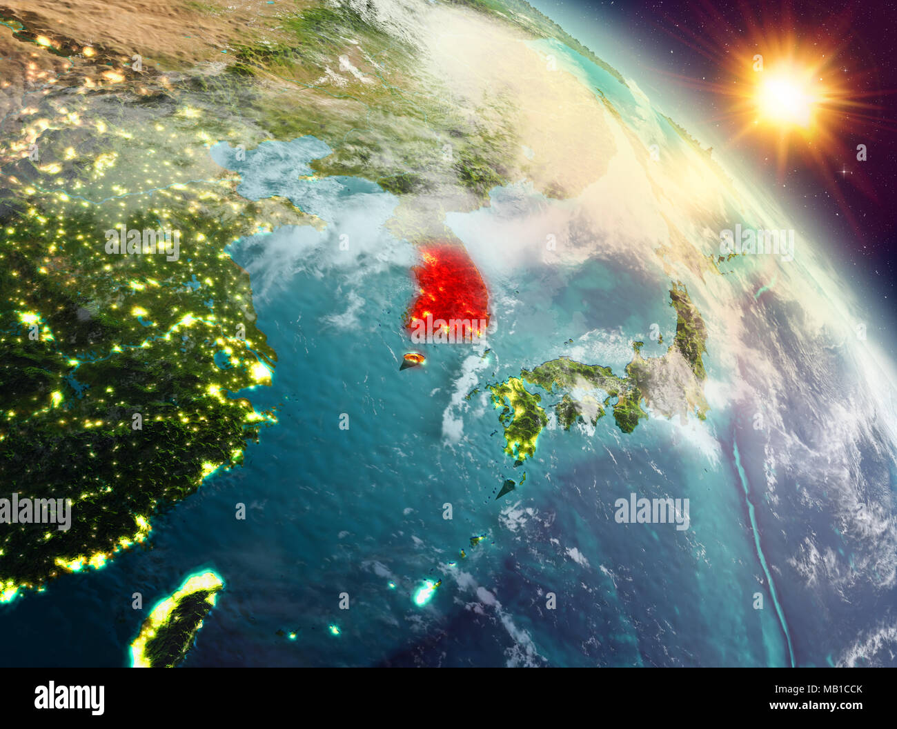 Sunrise above South Korea highlighted in red on model of planet Earth ...