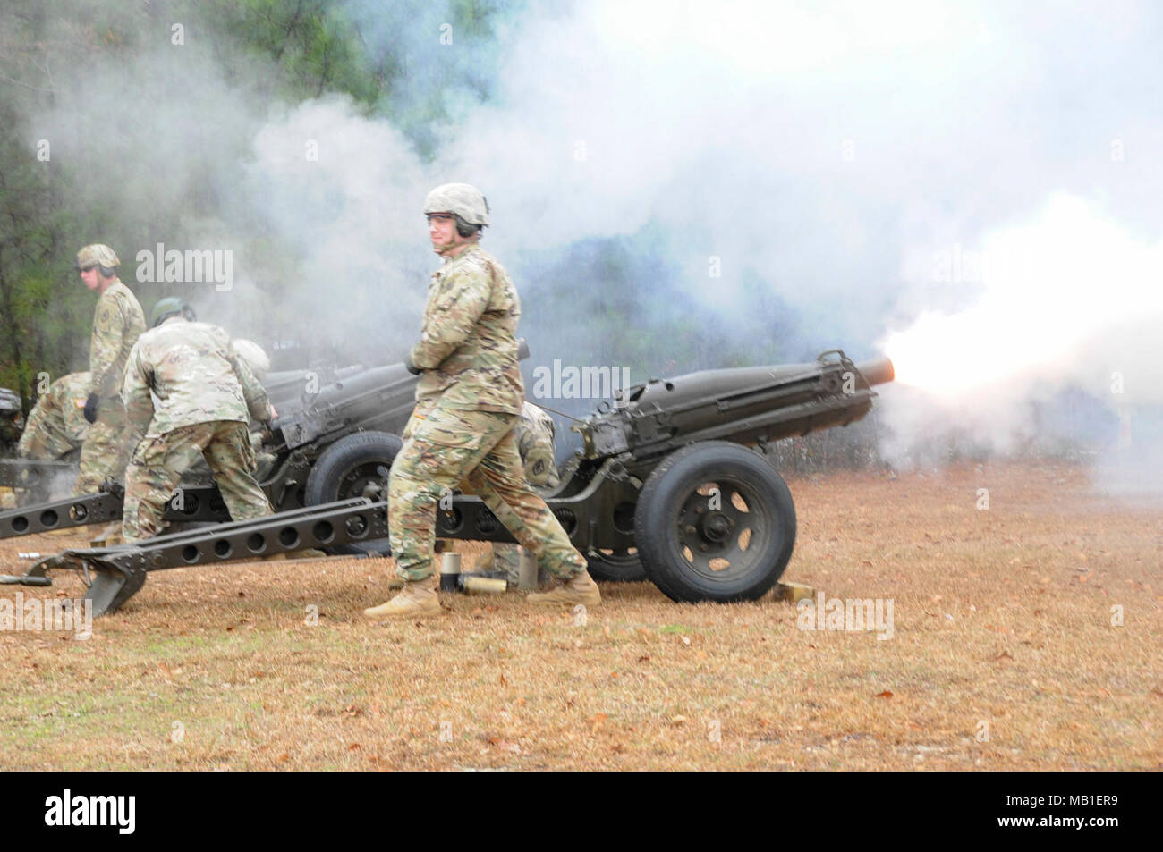 Soldiers from the Fort Jackson Honor Platoon, Headquarters and Alpha Company, Headquarters Headquarters Battalion render an artillery salute outside the 81st Readiness Division Headquarters in honor of Major General Kenneth D. Jones’ assumption of command on February 10, 2018. Stock Photo
