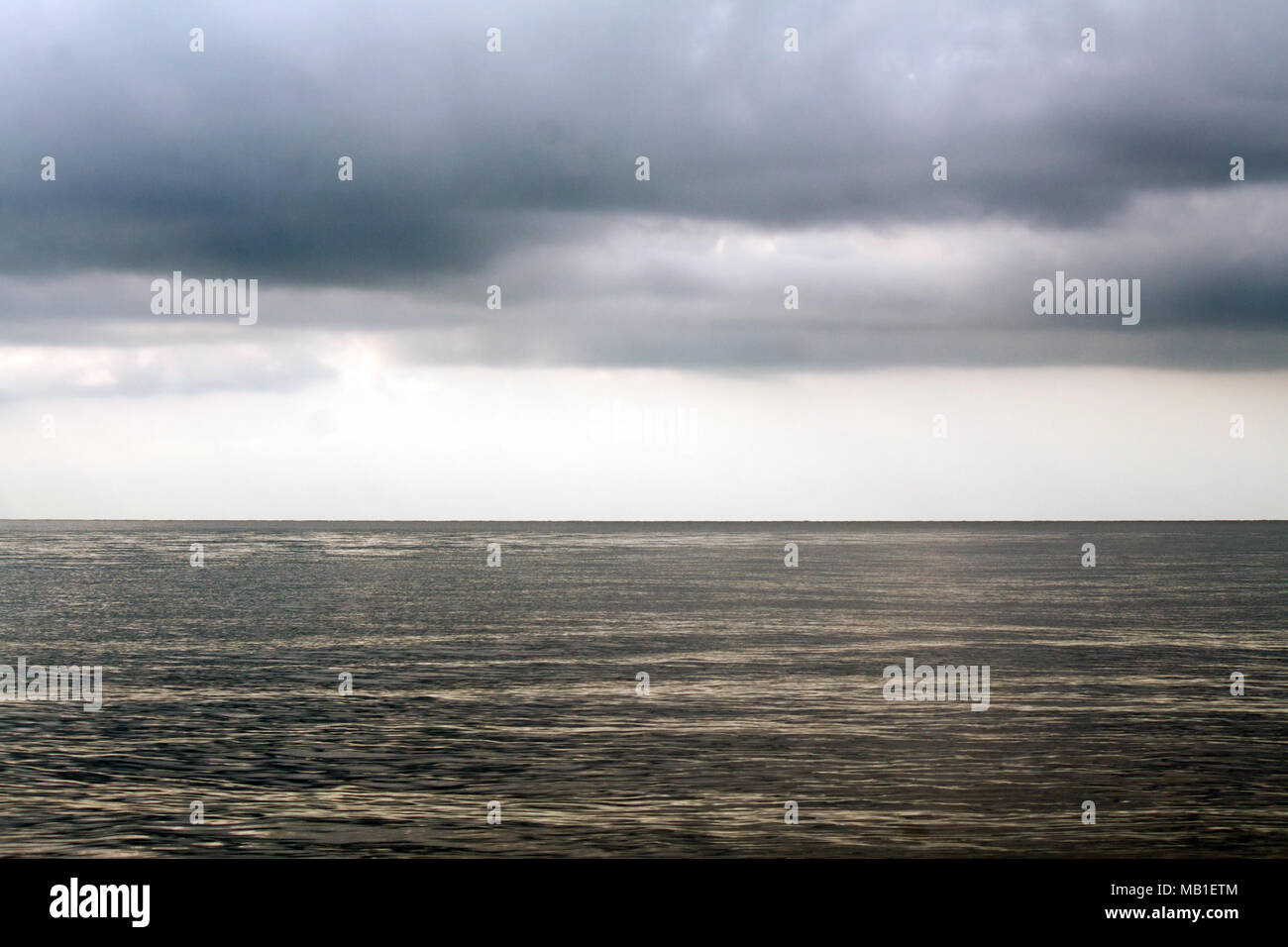Stormy sky with sunbeams over sea hi-res stock photography and images ...