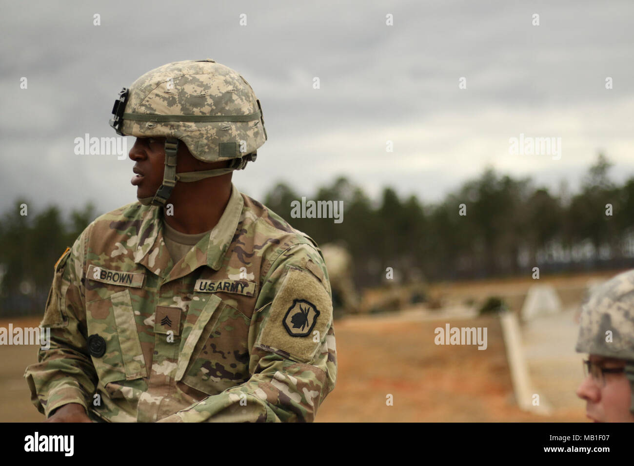 U.S. Army Reserve Drill Sergeant, Sgt. Andre Brown, assigned to the 98th Training Division watches as grenade rounds impact on a Mark 19 grenade launcher range. Soldiers from the 359th Theater Tactical Signal Brigade, 335th Signal Command (Theater) participated in a two-week crew-served weapons live-fire exercise, named Crew-Served-Mania at Fort Gordon, Georgia February 2018. Drill sergeants from the 98th Training Division provided weapons familiarization and served as assistant gunners during the event aimed at increasing the lethality of signal Soldiers. Stock Photo