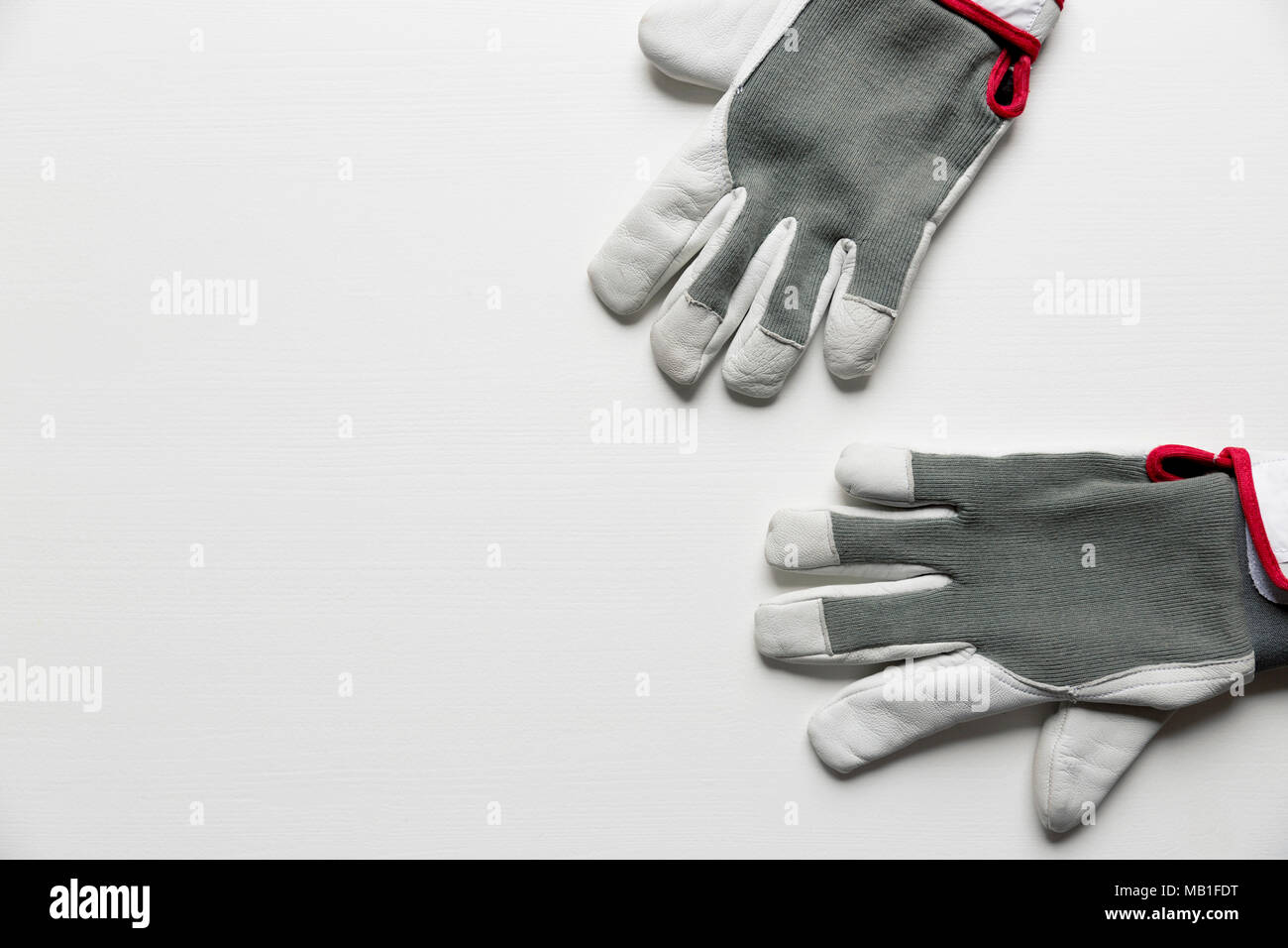 Working men's construction gloves isolated on white background Stock Photo