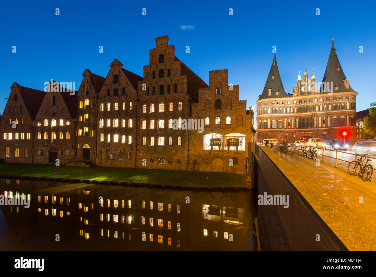 Salzspeicher / salt storehouses at night along the Upper Trave River in the Hanseatic town Lübeck / Luebeck, Schleswig-Holstein, Germany Stock Photo