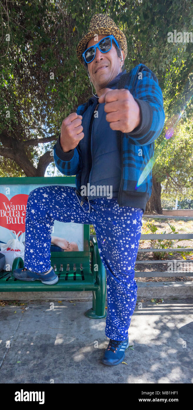 man in color coordinated blue clothes in Los Angeles, California Stock