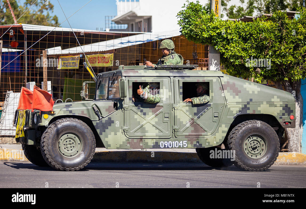 Puebla, Mexico - 11/21/2016: Mexican soldiers travelling in army vehicle Stock Photo