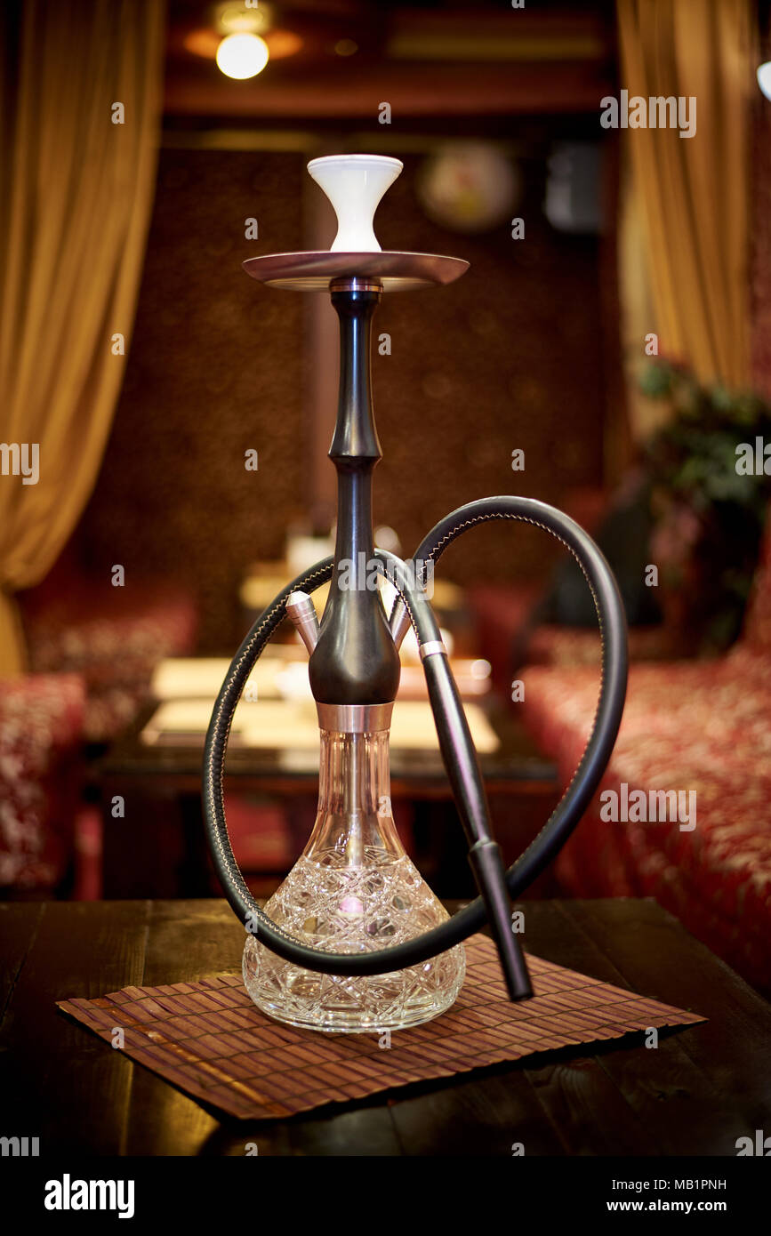 Glass hookah on the table in the living room shisha Stock Photo