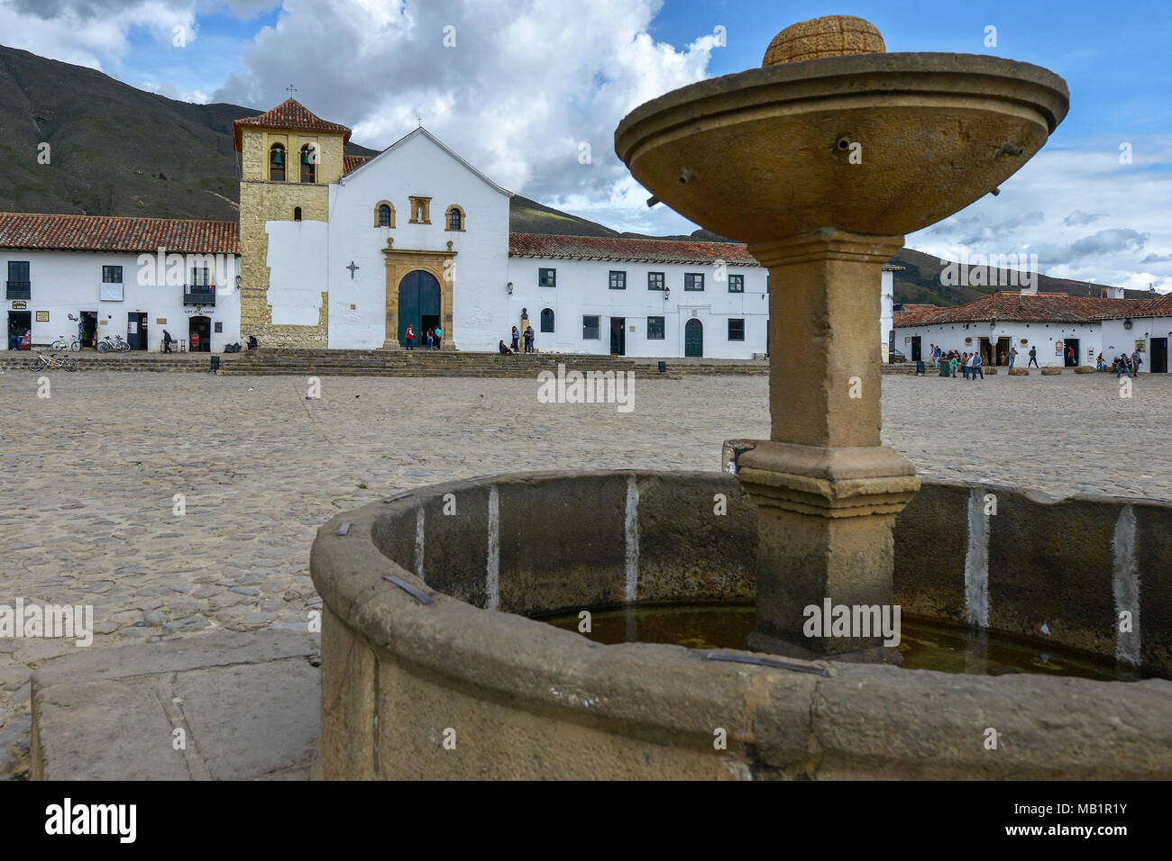 Villa De Leyva, Colombia - August 12, 2017: People in the Plaza Mayor, largest public square in Colombia in colonial town of Villa de Leyva, Colombia. Stock Photo