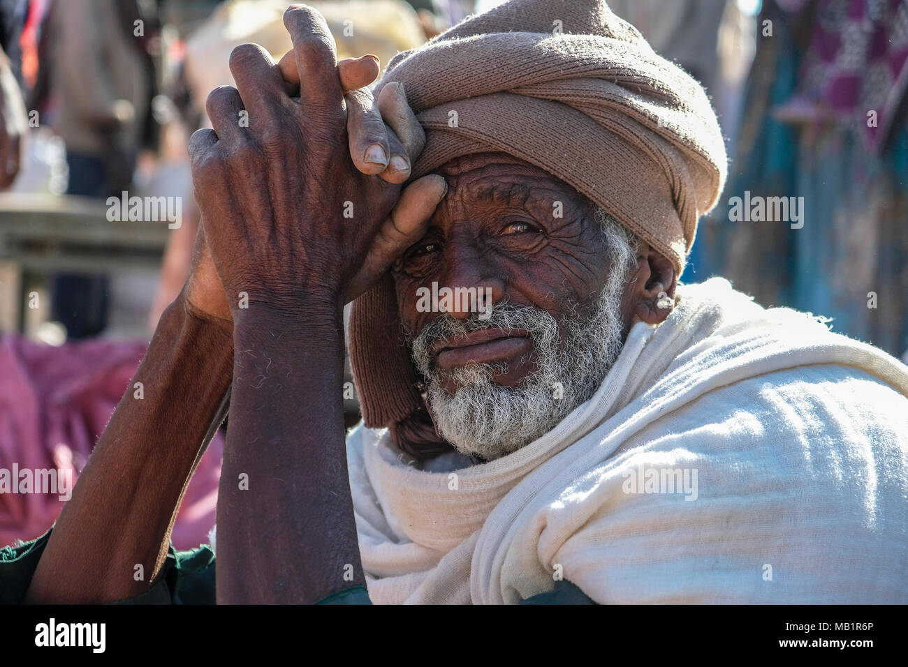 Hawzien, Tigray, Ethiopia - January 10, 2018: Portrait of an unidentified older man sitting in the Hawzien market in Hawzien, Tigray, Ethiopia. Stock Photo
