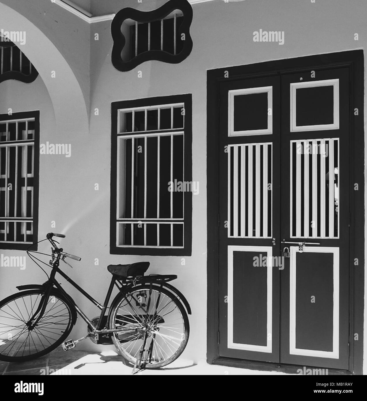 Brown door with white trim and white wall Stock Photo Alamy