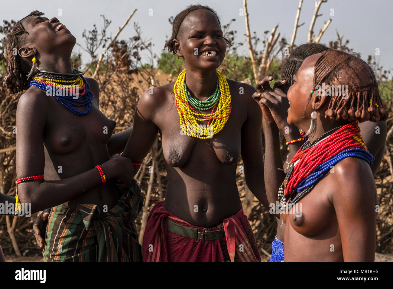 Omorate, Ethiopia - January 25, 2018: Women from Dassanech tribe posing for a portrait in their village near the Omorate river in Ethiopia. Stock Photo
