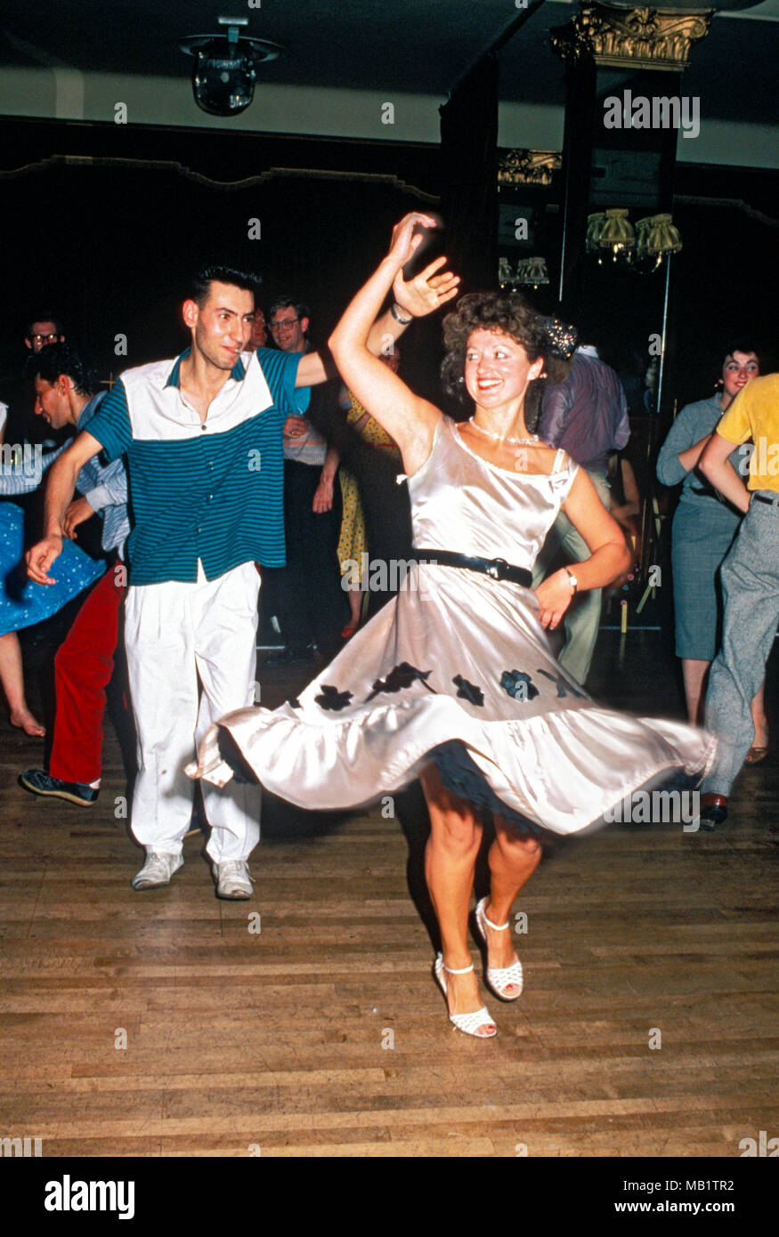 Couple wearing 1950s clothes jiving Stock Photo