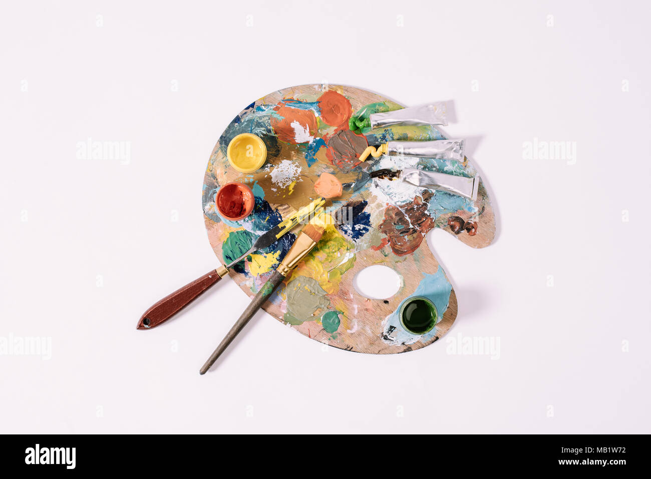 top view of palette with colorful paints isolated on grey Stock Photo