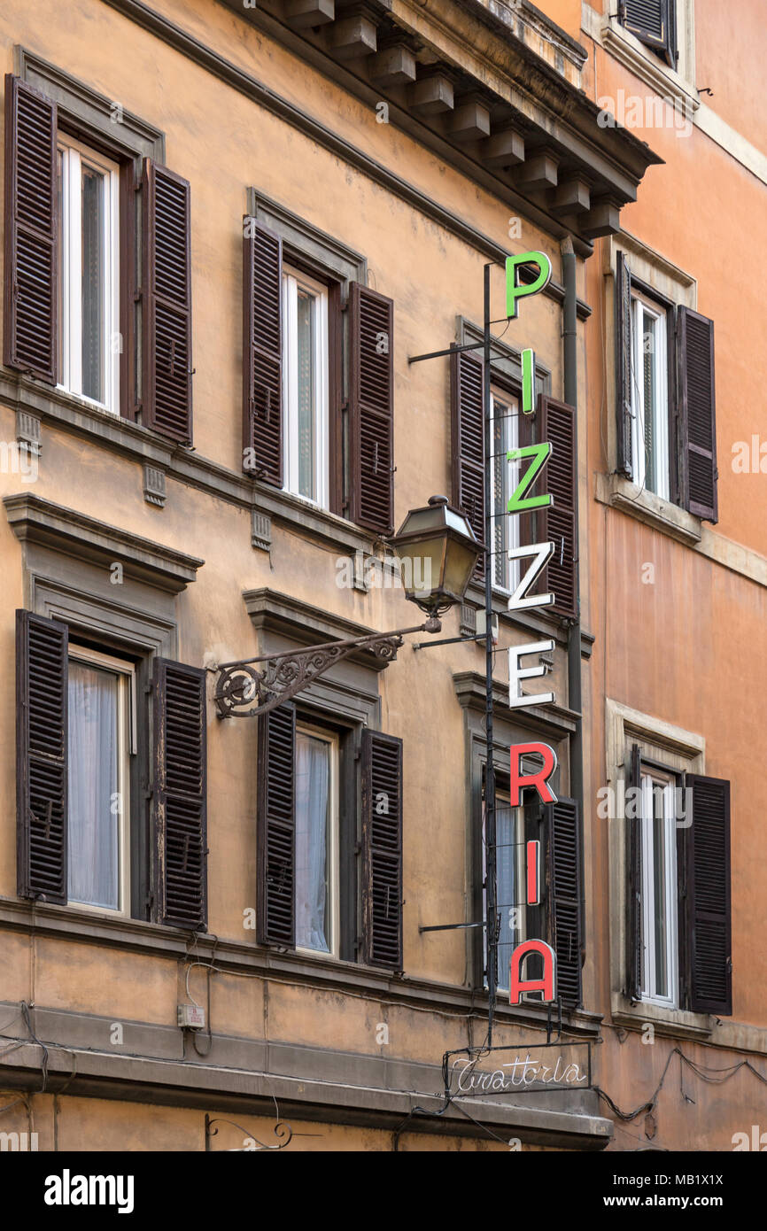 A Pizzeria sign above an Italian pizza restaurant in Rome, Italy. Stock Photo