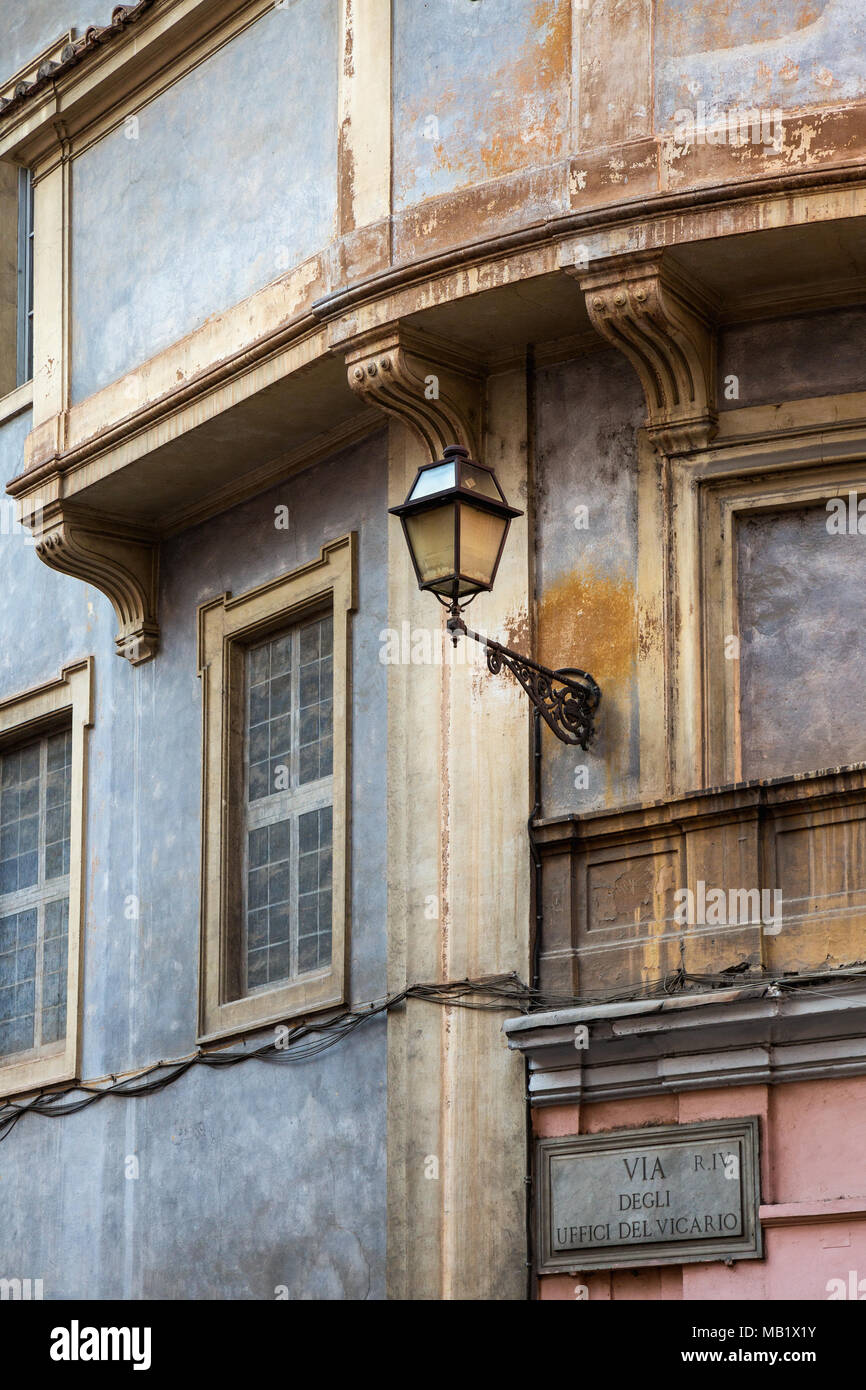 Architectural detail on a old weathered building on a street corner in Rome Italy. Stock Photo