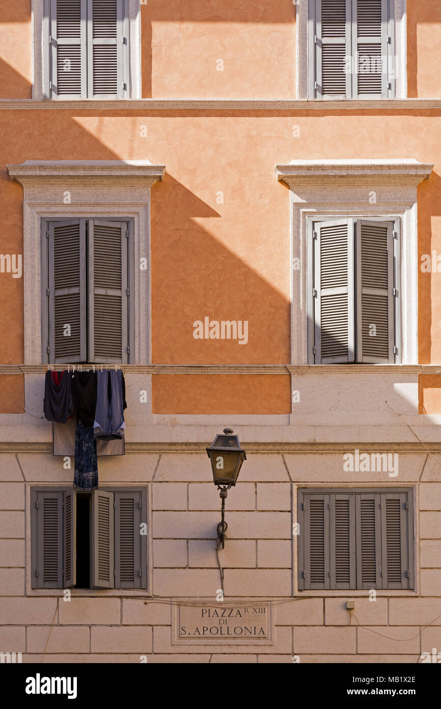 Washing hanging out side a building in Piazza di San Apollonia in Rome, Italy. Stock Photo