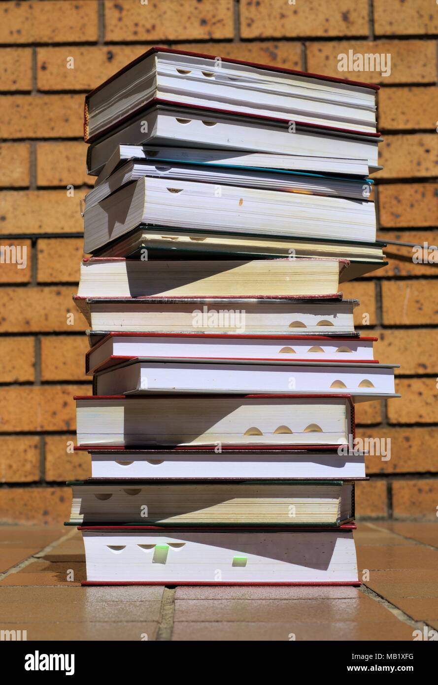 Stack of books. Pile of books outdoors. Several old books one top of the other. Stock Photo