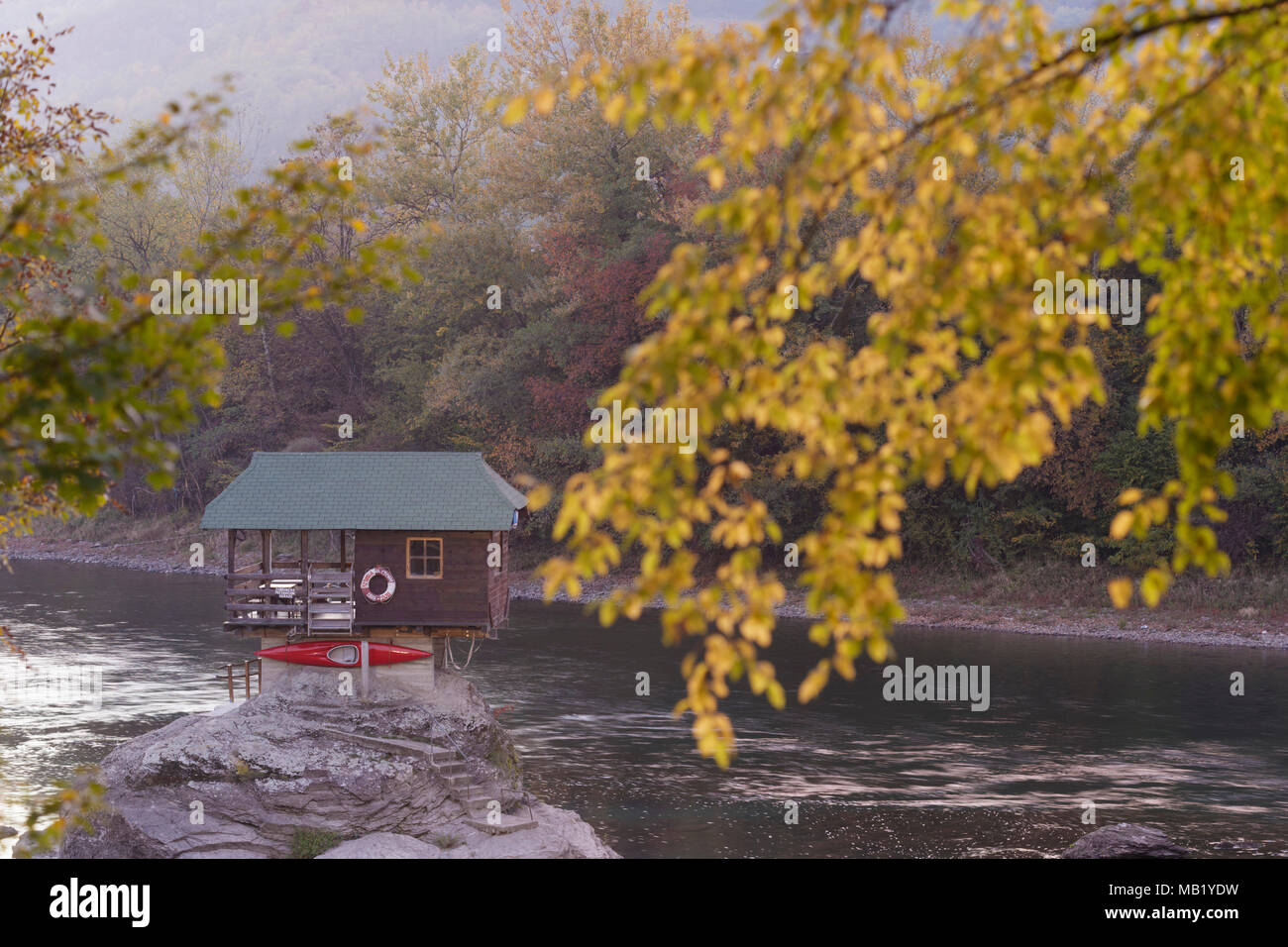 The house on the River Drina, with Autumn leaf colour, Bajina Basta, Serbia, October Stock Photo