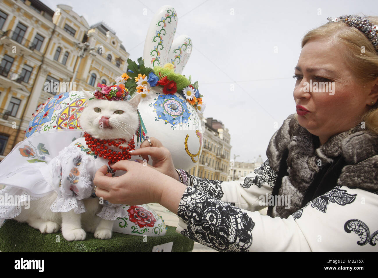 April 5, 2018 - Kiev, Ukraine - A woman with her a cat dressed in an ...