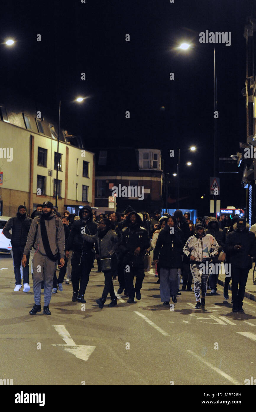 Marchers from the grassroots community organisation, GANG (Guiding A New Generation) along Morning Lane, Hackney, London, United Kingdom.  The demonstration follows the death on Wednesday (04.04.2018) of 18-year-old Israel Ogunsola who was stabbed to death and died in Link Street, Hackney. Police found him wounded after they were alerted by a motorist just before 8.00pm.   He was given first aid by police officers, but died at the scene at 8.24pm. He was initially thought to be aged in his 20s.  GANG is a youth outreach movement which focusses on the black community and implores young men in t Stock Photo