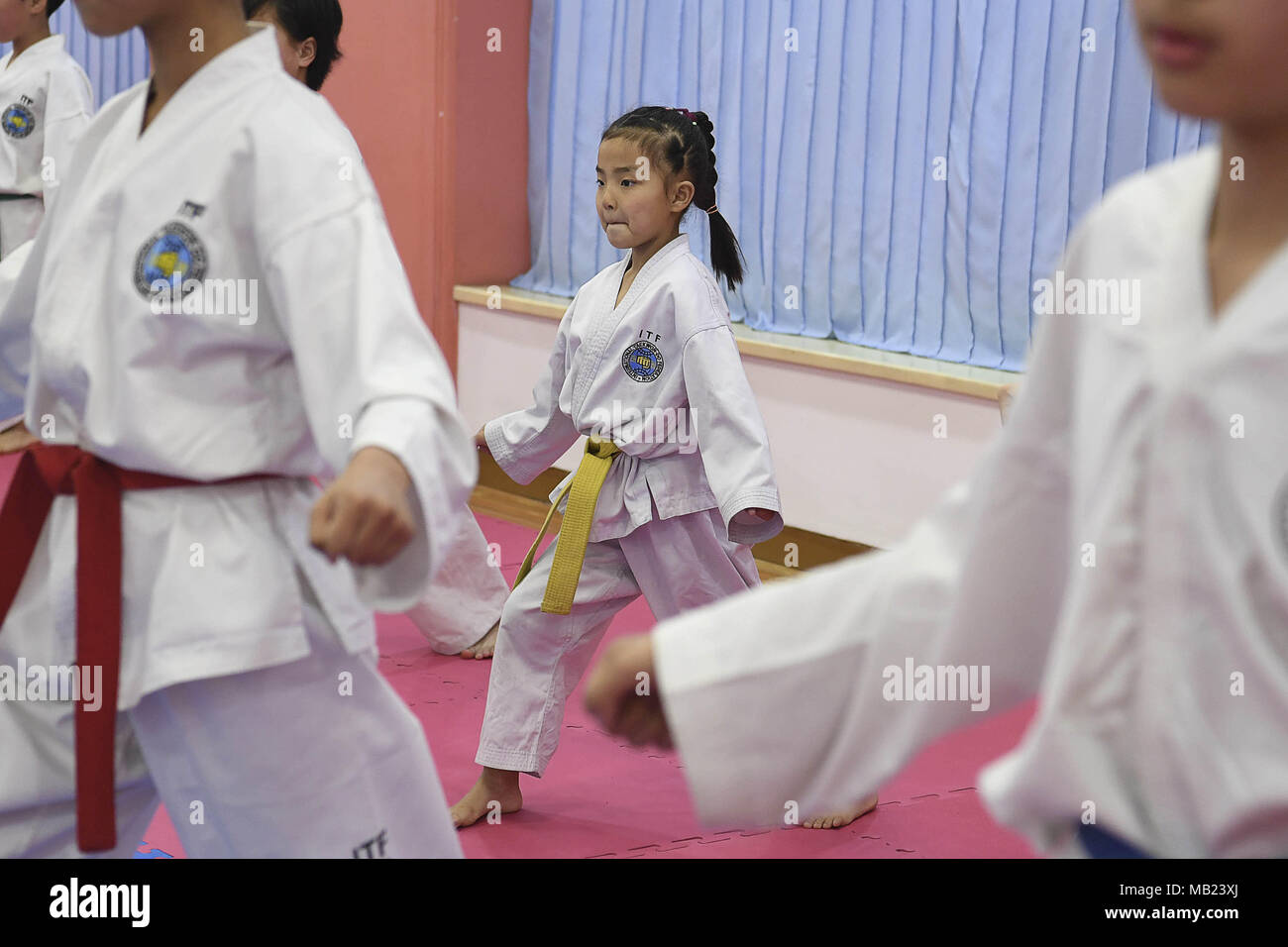 Pyeongyang, NORTH KOREA. 3rd Apr, 2018. March 3, 2018-Pyeongyang, North Korea-North Korean students at the Mankyungdae Boys ' Palace take taekwondo lessons. The date approaches, for better or worse. On April 27, the leaders from the two Koreas, technically still at war, will hold a summit at the border. The parties met today to work out security details. To hold talks with South Korean president Moon Jae-in, the leader of North Korea, Kim Jong-un, will take unprecedented steps for a man in his position literally. The summit will be held south of the military demarcation line in the truce vil Stock Photo