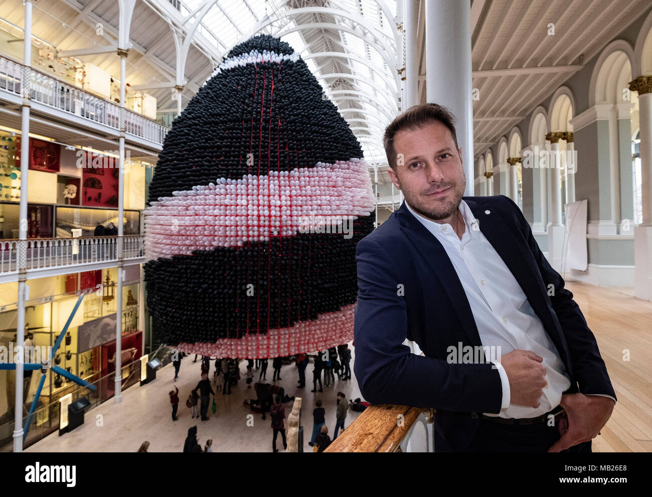 Edinburgh, UK. 6 April, 2018. Event Horizon balloon sculpture unveiled at National Museum of Scotland. American artist Jason Hackenwerth returns to Edinburgh with his biggest creation yet: a 30,000 strong balloon sculpture hanging from the top of the National Museum of Scotland’s Grand Gallery. This will be currently the biggest balloon sculpture in the world. The installation is part of Edinburgh International Science Festival. Credit: Iain Masterton/Alamy Live News Stock Photo