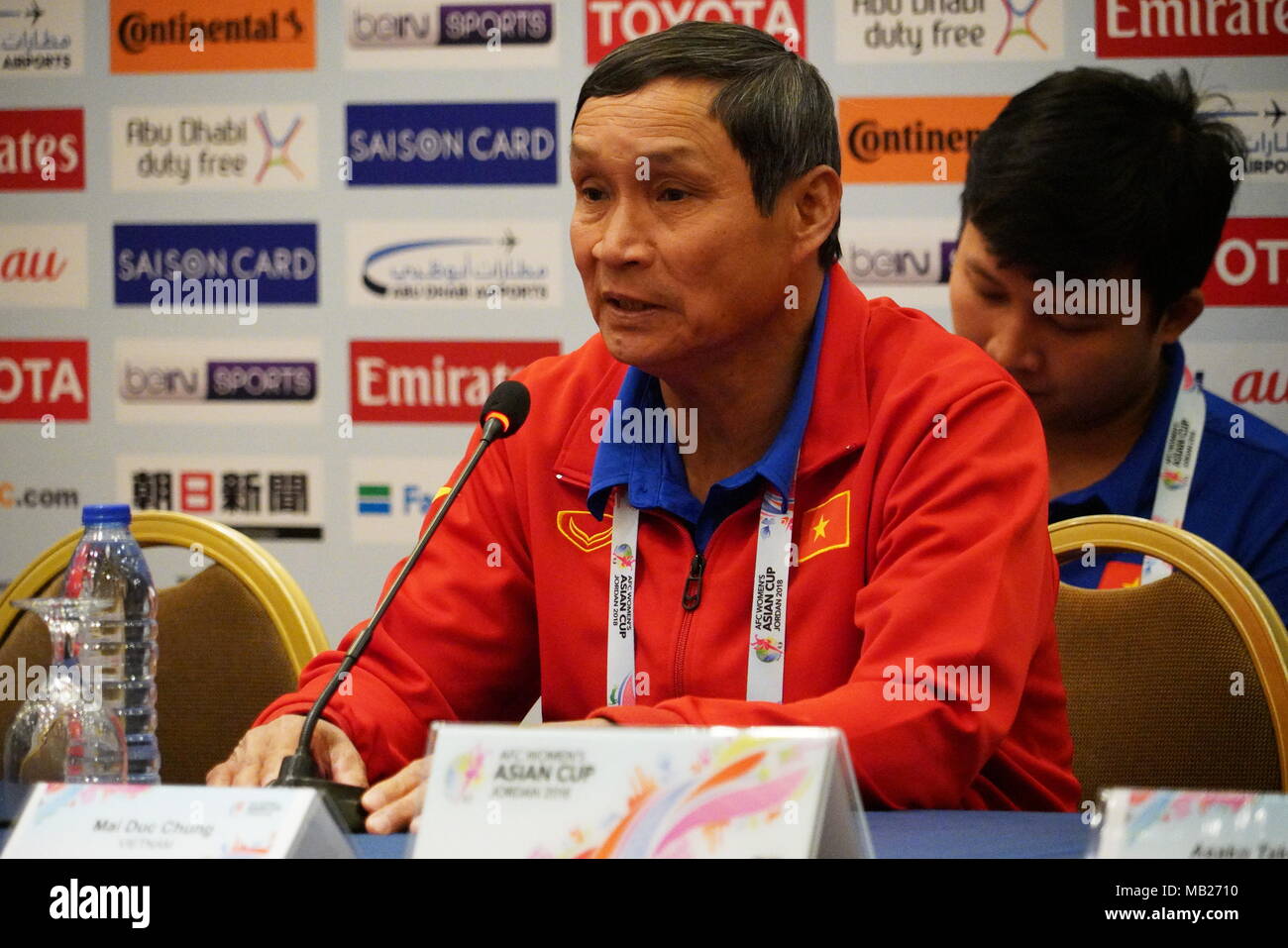 Amman, Jordan. 6th Apr, 2018. Mai Duc Chung (front), head coach of  Vietnamese women football team, attends a press conference prior to the  match between Japan and Vietnam at 2018 AFC Women's