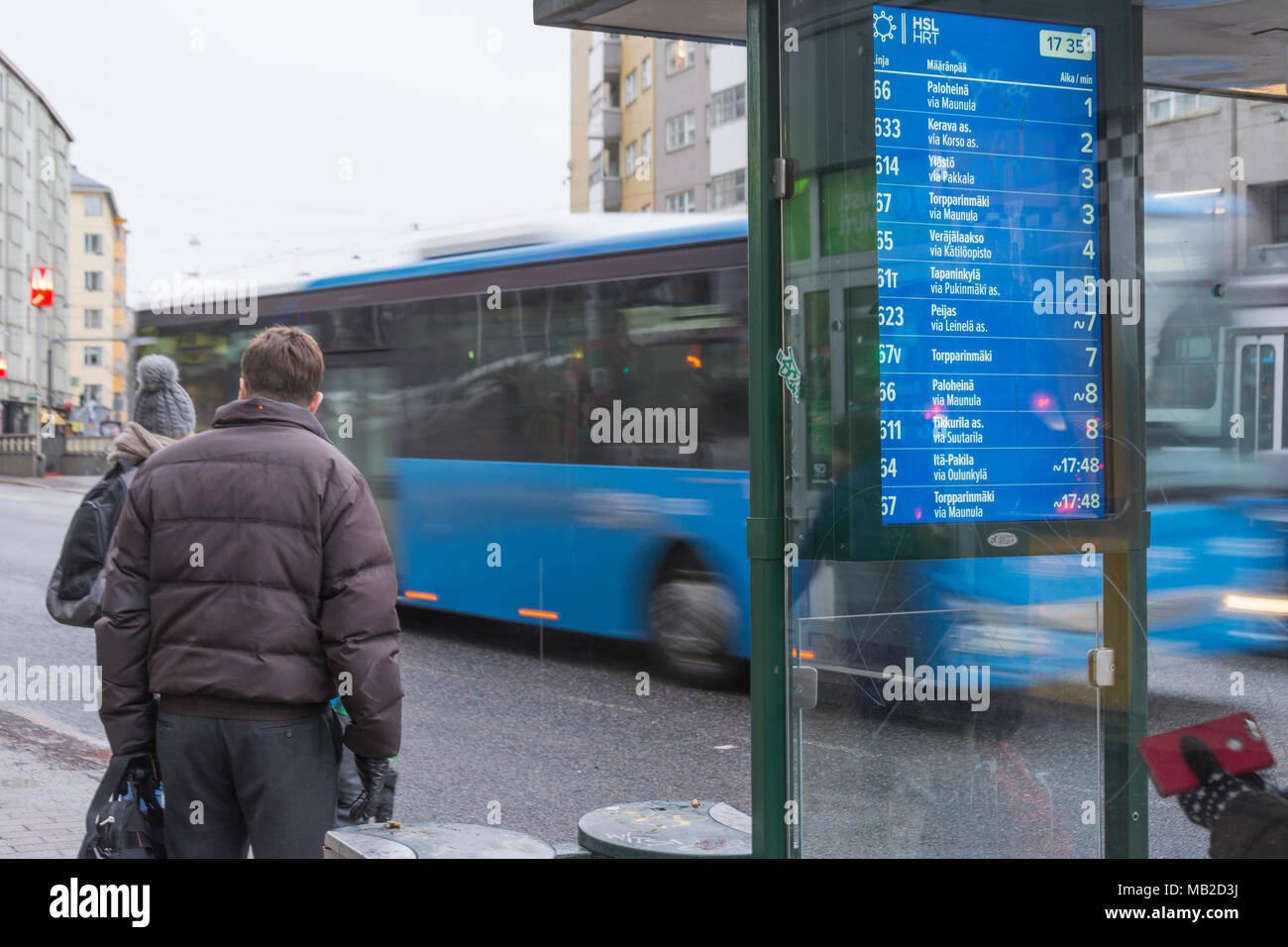 Blue bus timetables display in Helsinki Finland Stock Photo - Alamy