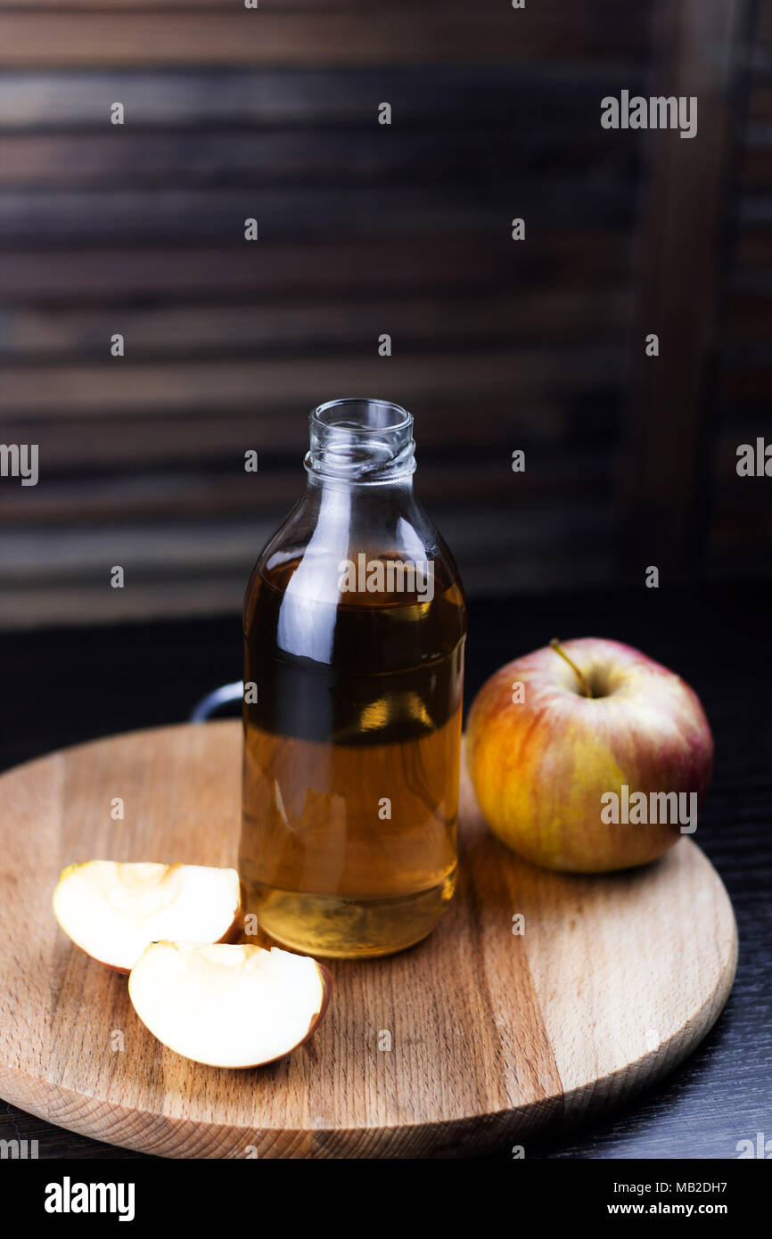 bottle of fresh apple drink wooden background Stock Photo