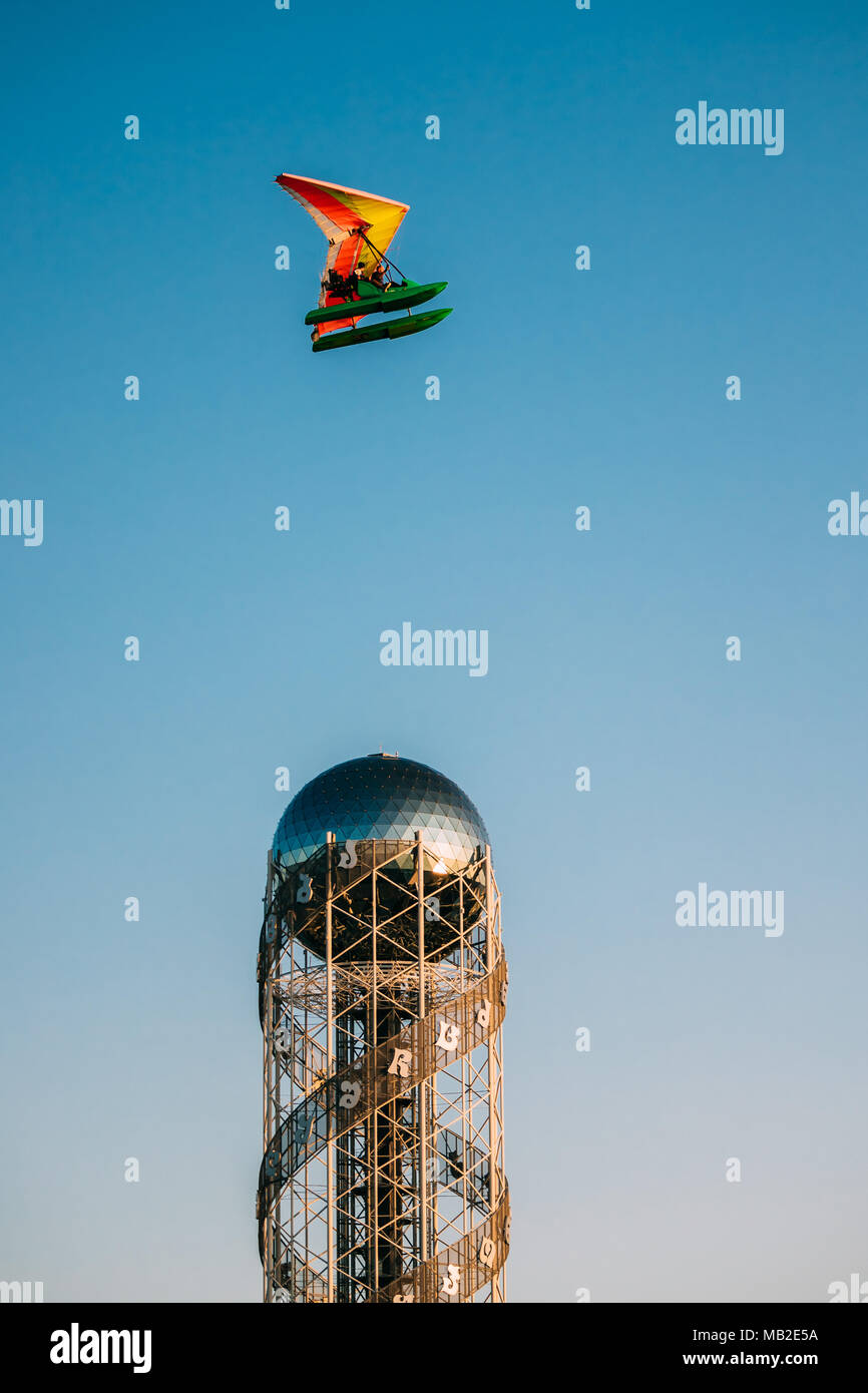 Batumi, Adjara, Georgia. Motorized Hang Glider Flying Above Modern Building Alphabet Tower Stock Photo