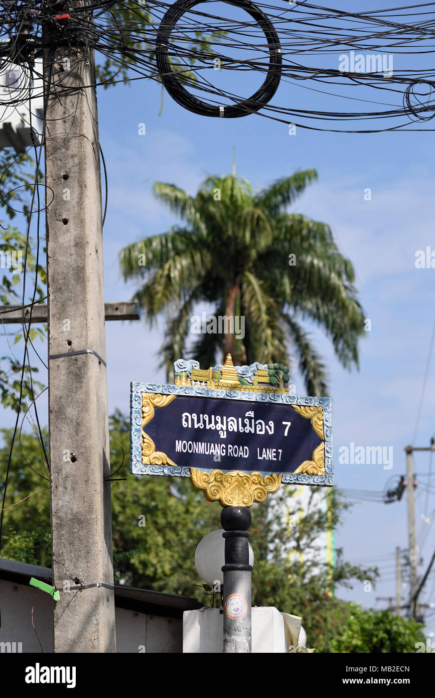 artistic road sign and cable pole, Chiang Mai, Thailand Stock Photo