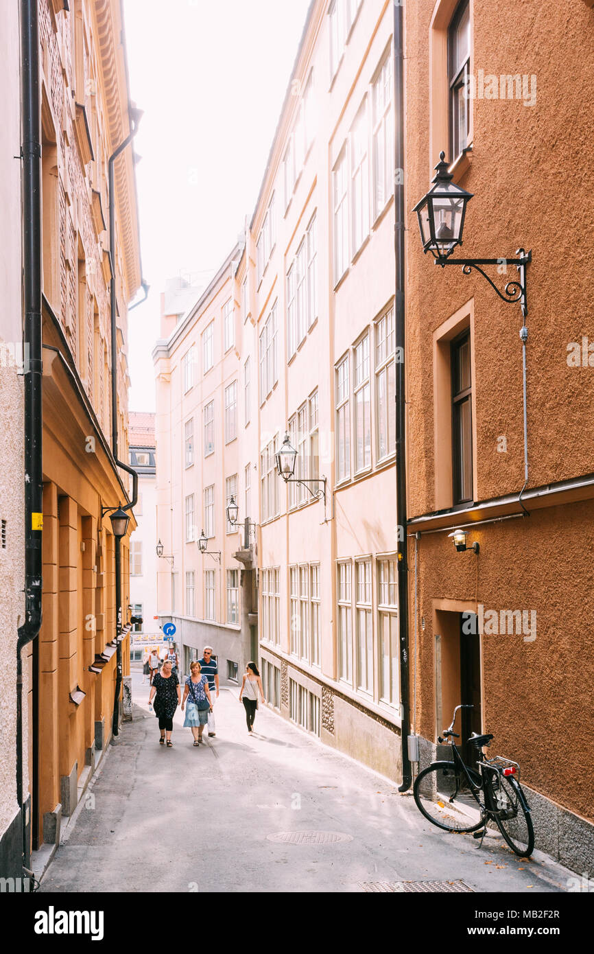 Stockholm, Sweden - July 29, 2014: People Walking Along One Of Narrow Streets In Stockholm, Sweden Stock Photo