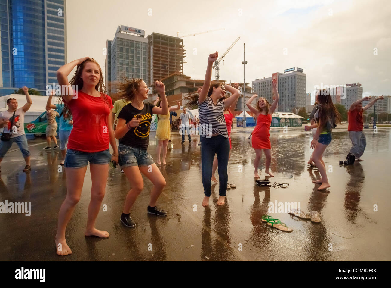 https://c8.alamy.com/comp/MB2F3B/minsk-belarus-may-9-2014-young-people-dancing-during-rain-in-front-of-the-palace-of-sports-MB2F3B.jpg