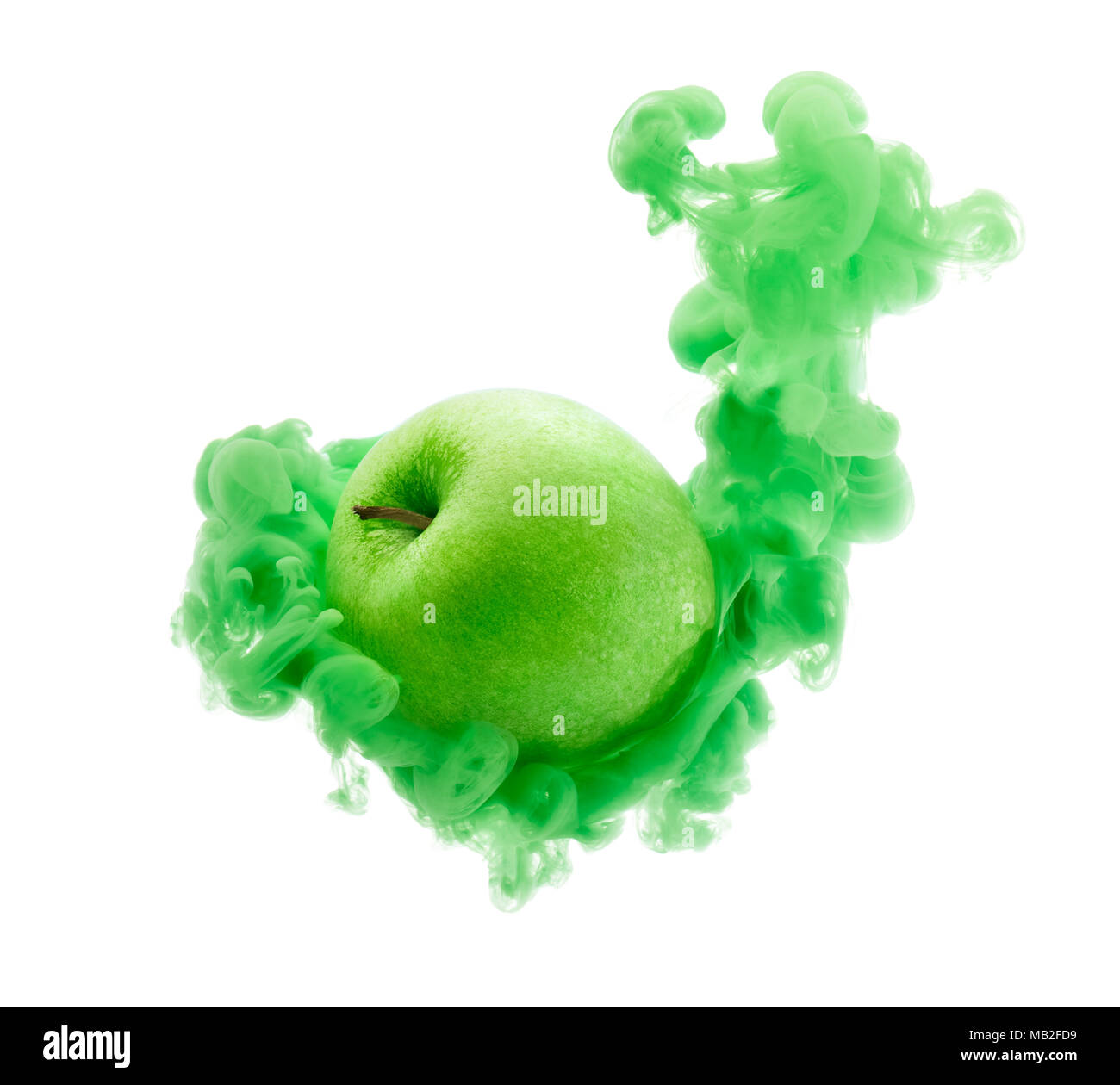 Green apple on ink isolated over white background Stock Photo