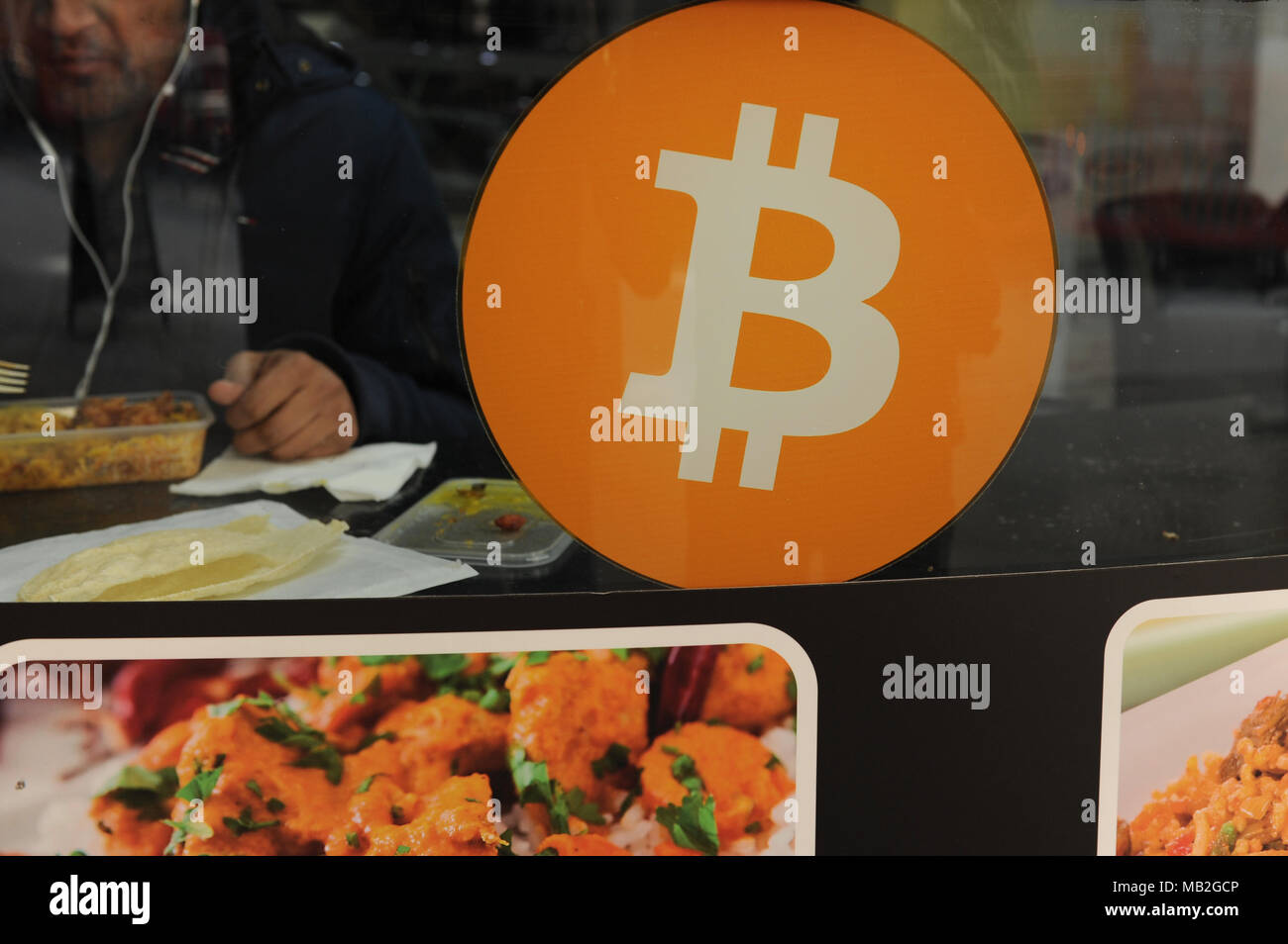Bitcoin sign advertising a Bitcoin ATM machine in a Post office in central London, England Stock Photo
