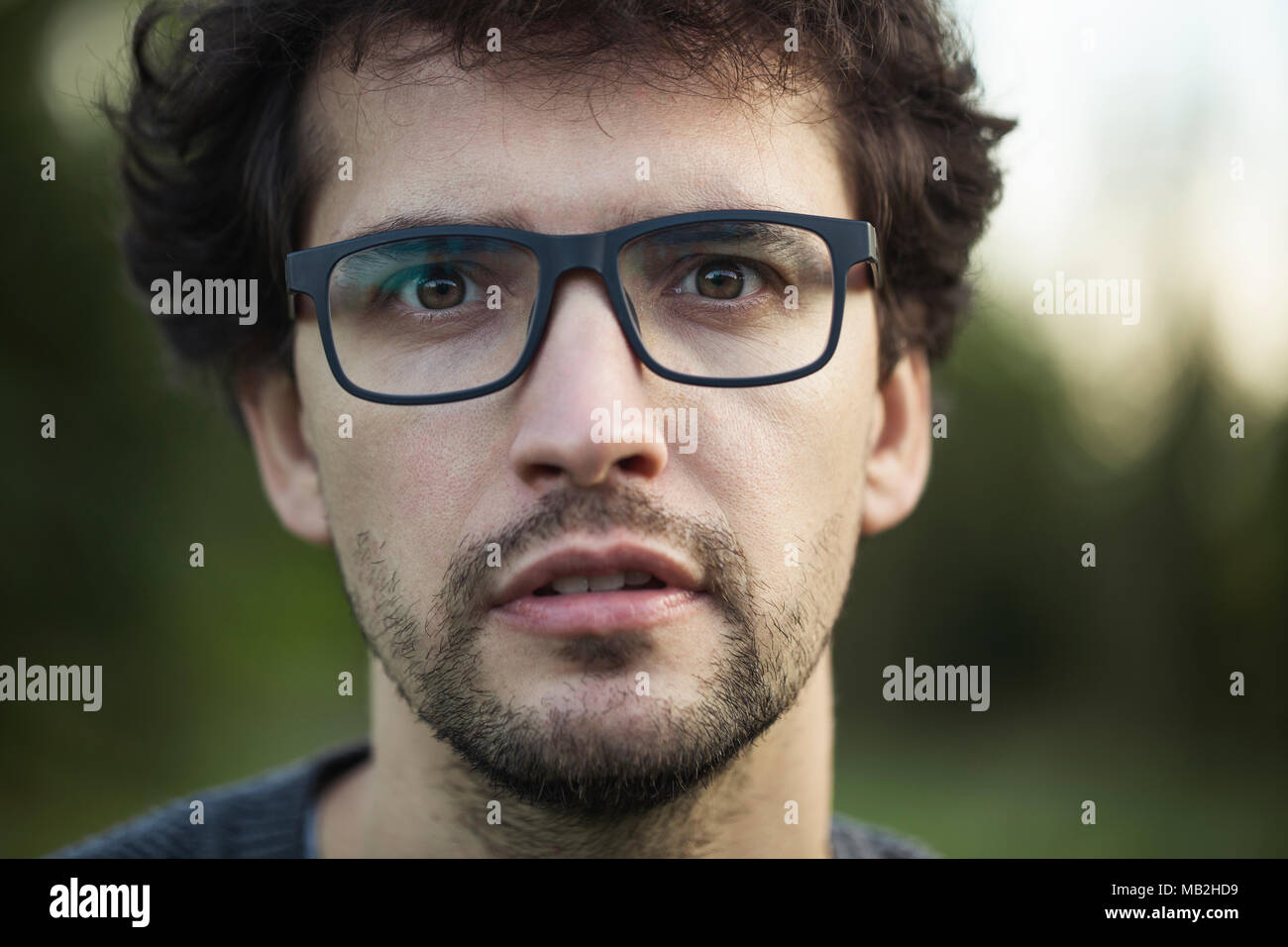 Young attractive man posing outside Stock Photo