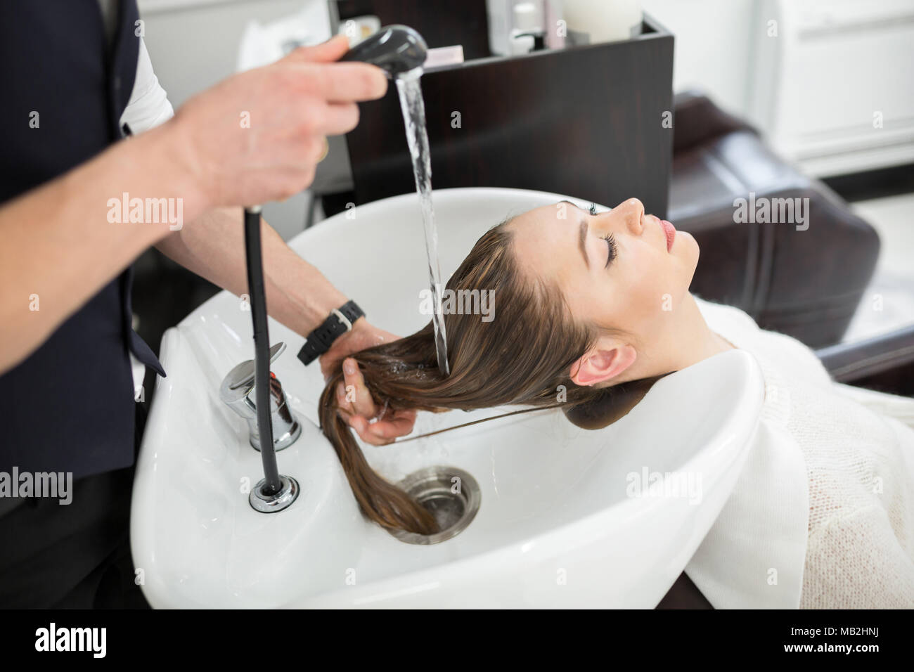 Portrait of young woman having hair washing at hairdresser Stock Photo - Alamy Portrait of young woman having hair washing at hairdresser Stock Photo - Alamy