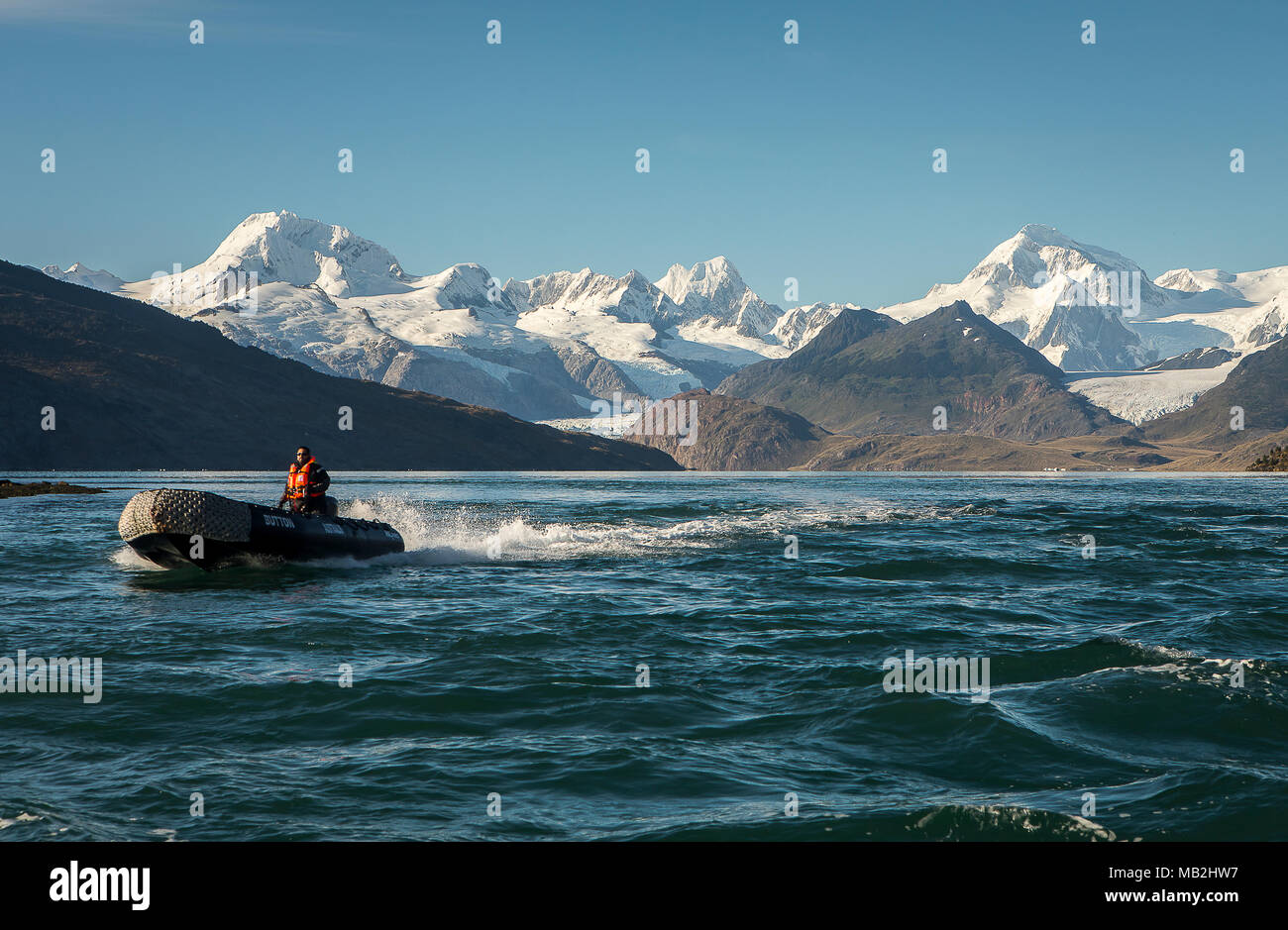 Zodiac and Cordillera Darwin, Ainsworth Bay, PN Alberto de Agostini, Tierra del Fuego, Patagonia, Chile Stock Photo
