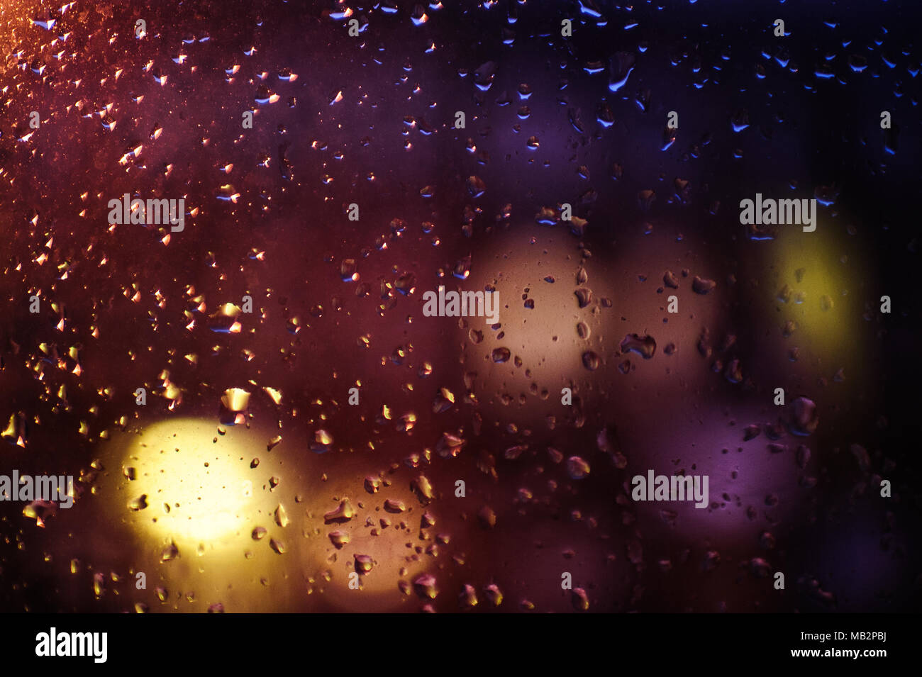 Rain drops on a window at night in New York City, February 2013. Stock Photo