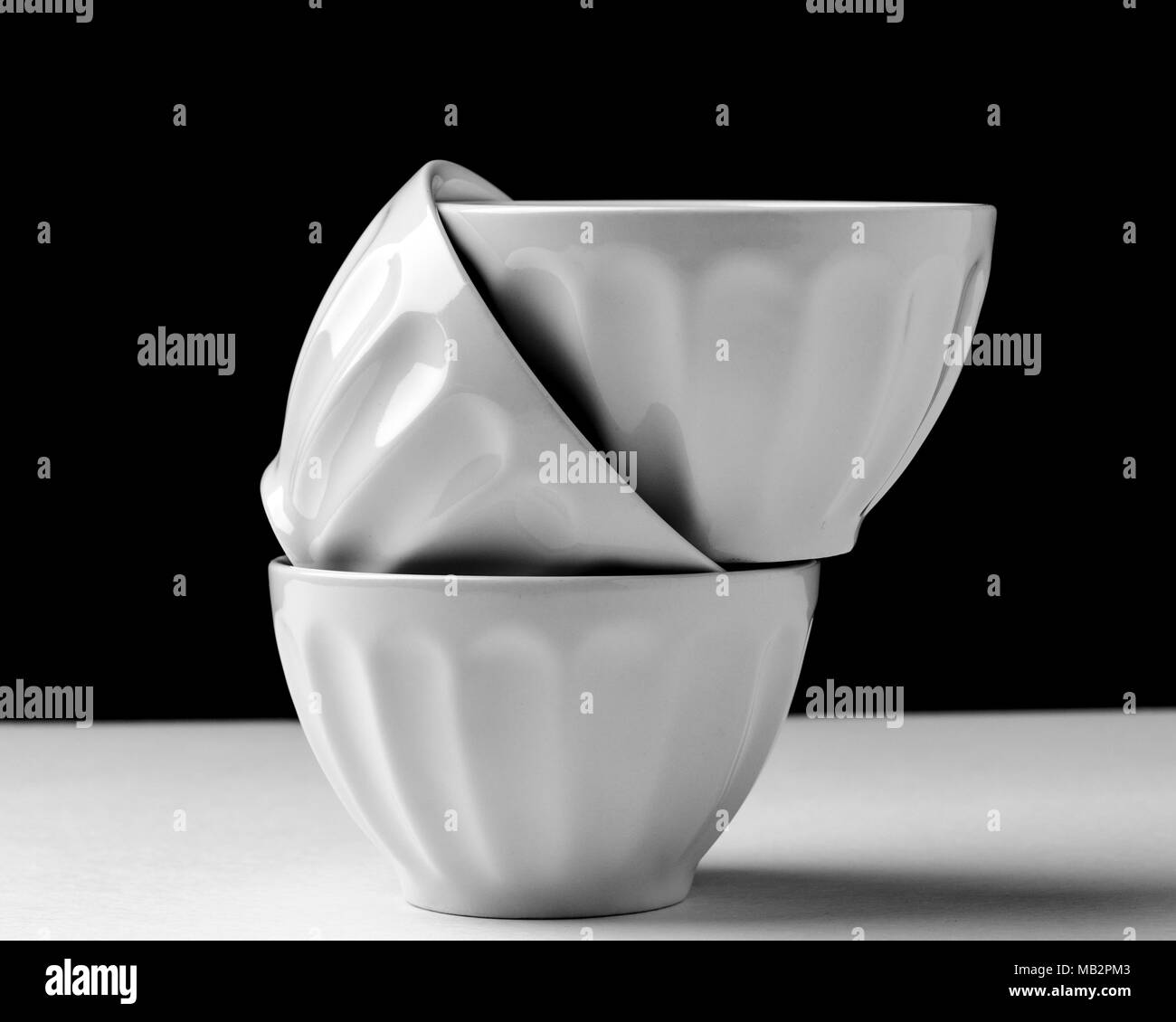 White bowl isolated on black and white background used in kitchens Stock Photo