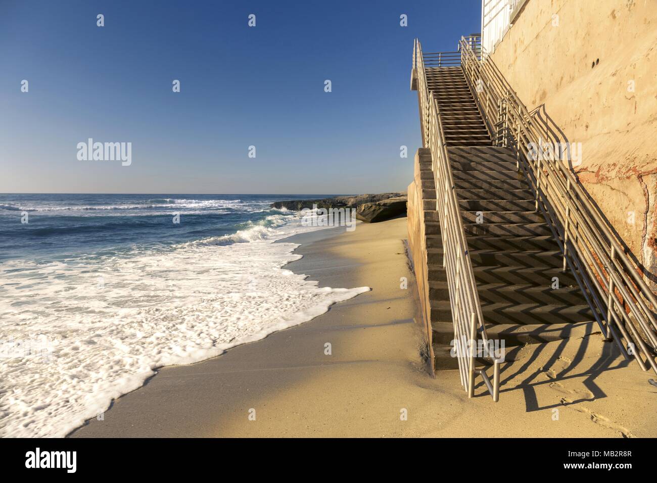 Stone Stairs and Pacific Ocean Waterfront on Windansea Beach, California Coastline near La Jolla San Diego Stock Photo
