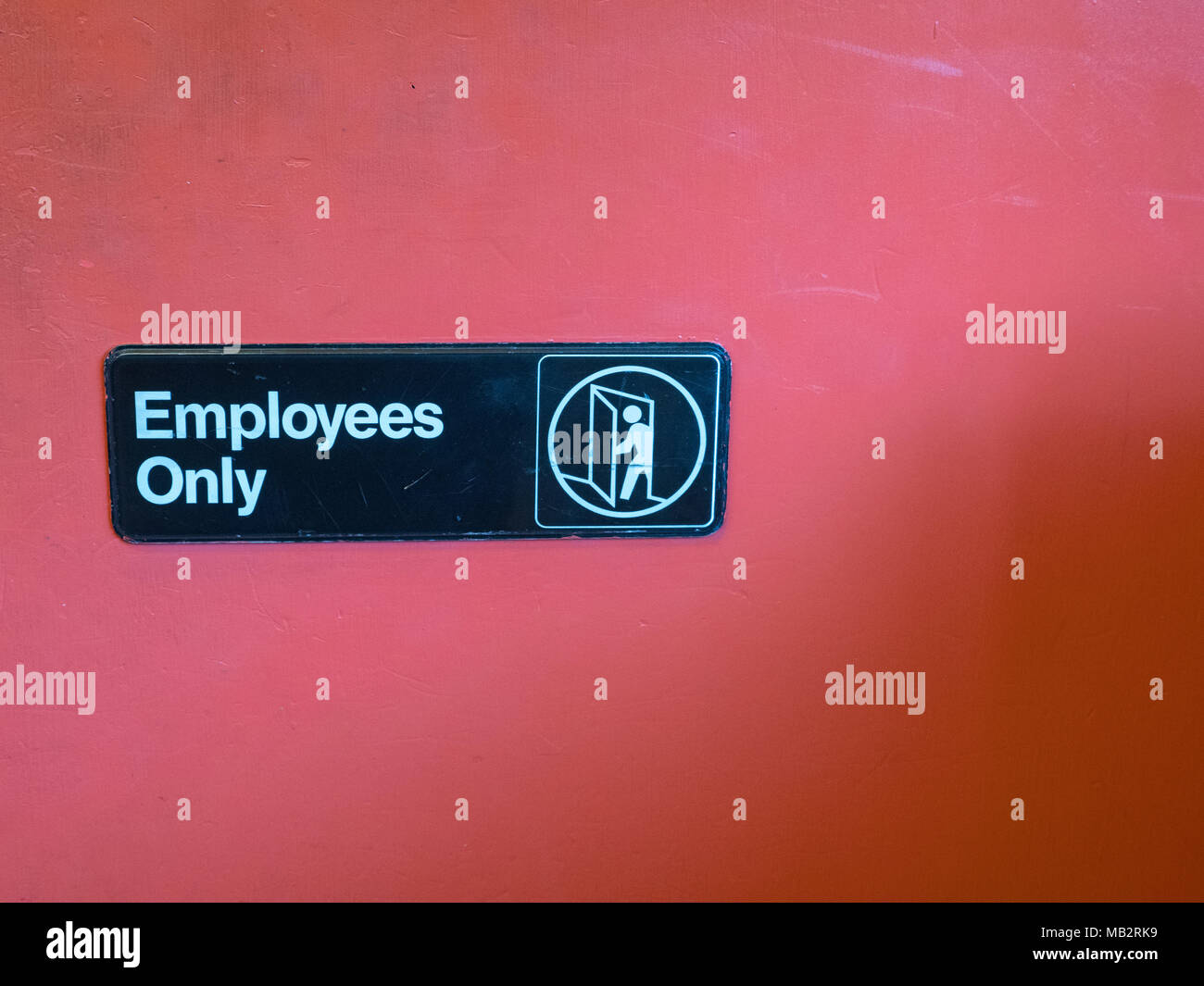 Employees only sign with space to right Stock Photo
