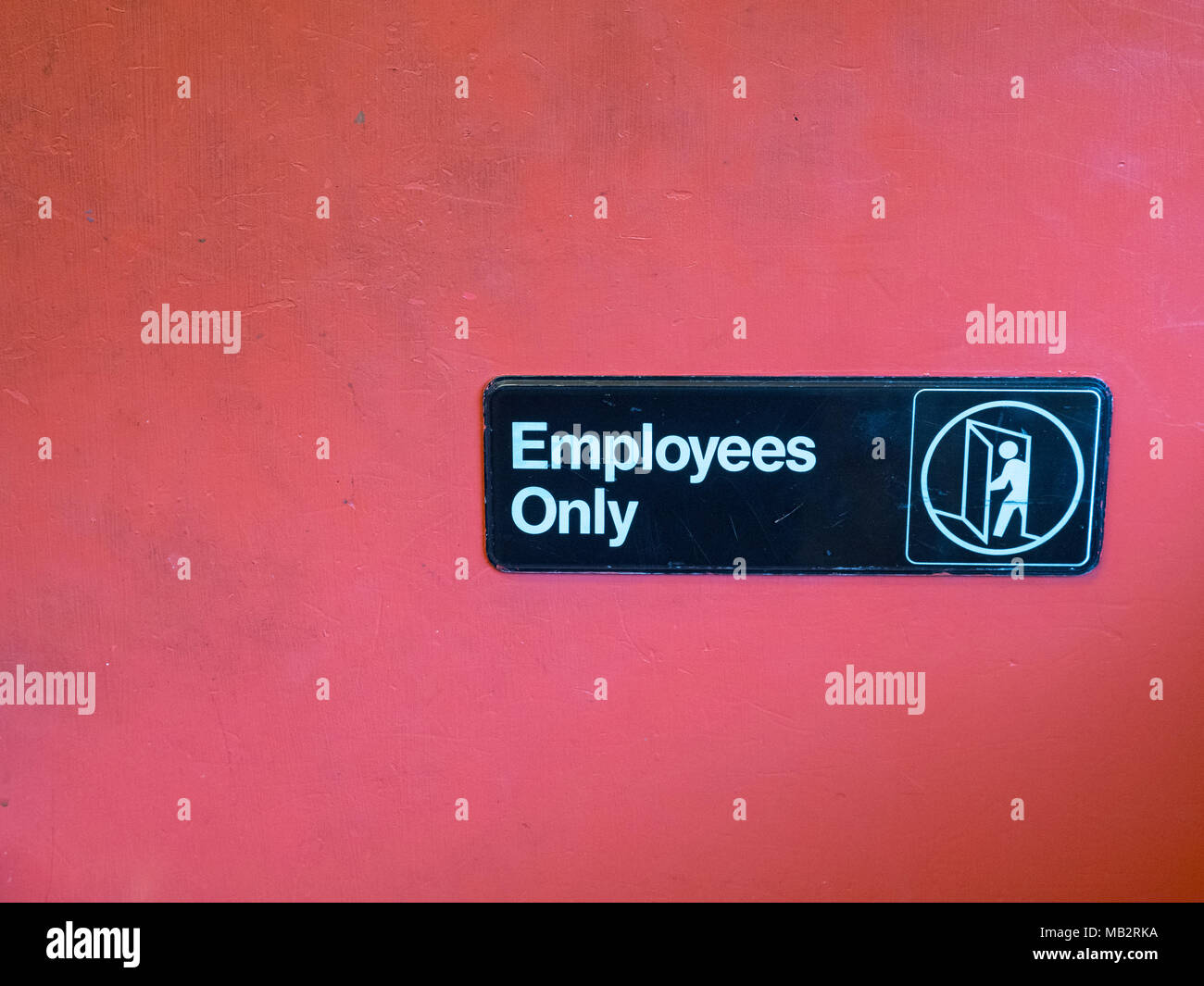 Employees only sign with space to left Stock Photo