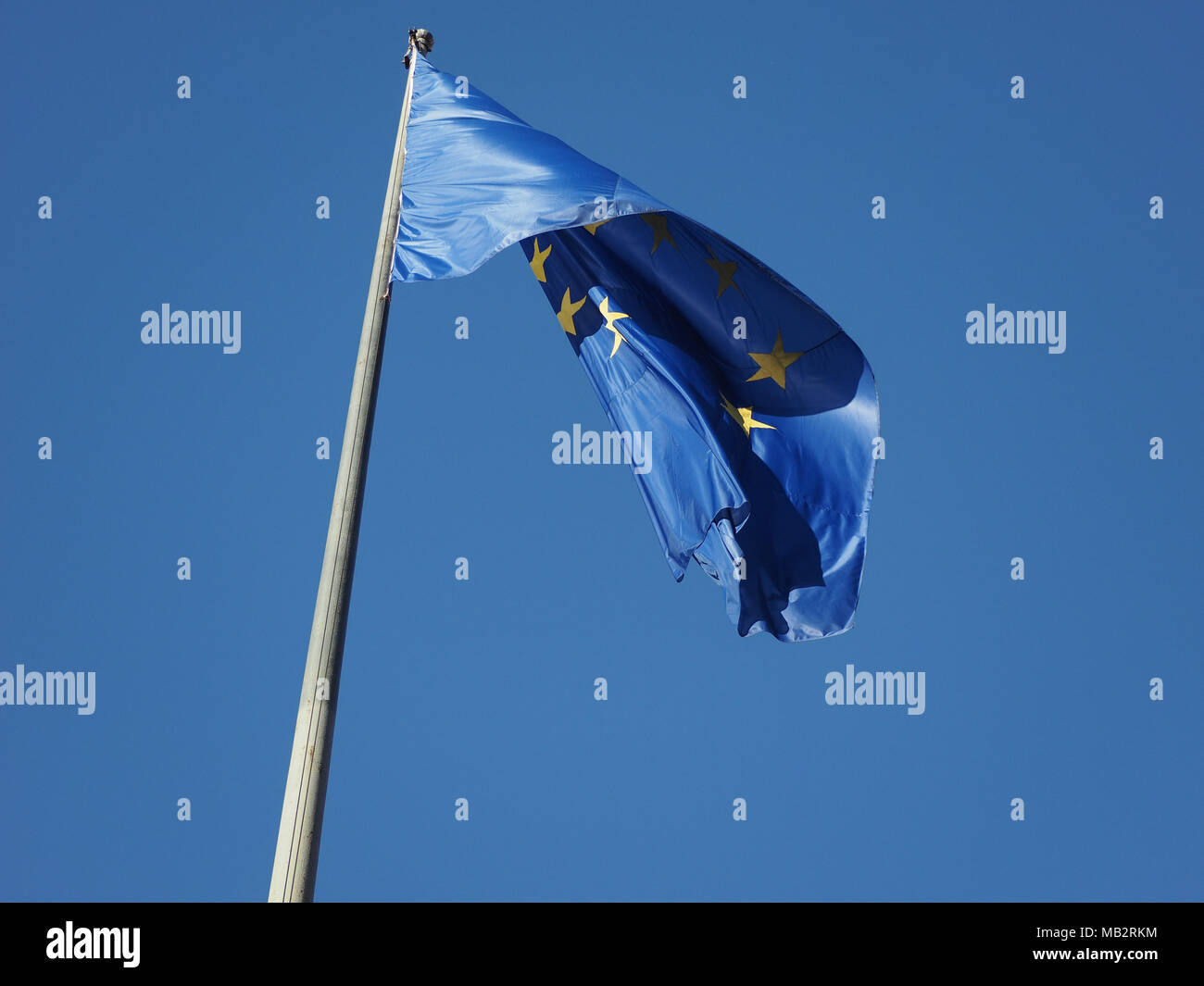 flag of the European Union (EU) aka Europe over blue sky Stock Photo ...