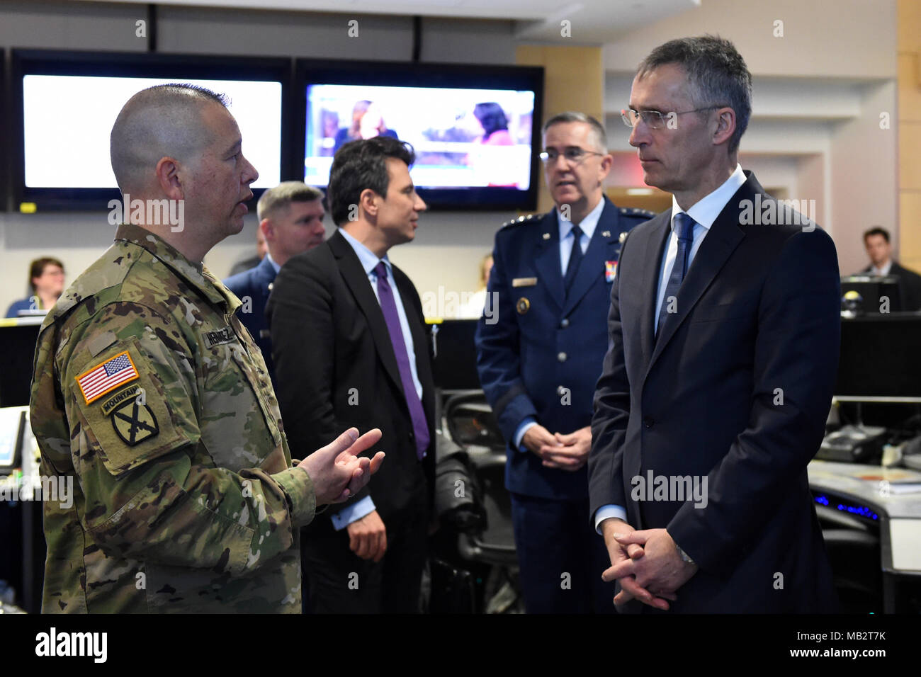 NATO Secretary General Jens Stoltenberg receives a brief from U.S. Army Col. Ray Hernandez, battle watch commander, during a tour of U.S. Strategic Command’s (USSTRATCOM) global operations center (GOC) at Offutt Air Force Base, Neb., April 6, 2018.  During his visit, Stoltenberg toured the command’s GOC and participated in discussions with U.S. Air Force Gen. John Hyten, commander of USSTRATCOM, other senior leaders and subject matter experts on the continuing U.S. commitment to supporting NATO and allies. (U.S. Navy photo by Mass Communication Specialist 1st Class Julie R. Matyascik) Stock Photo
