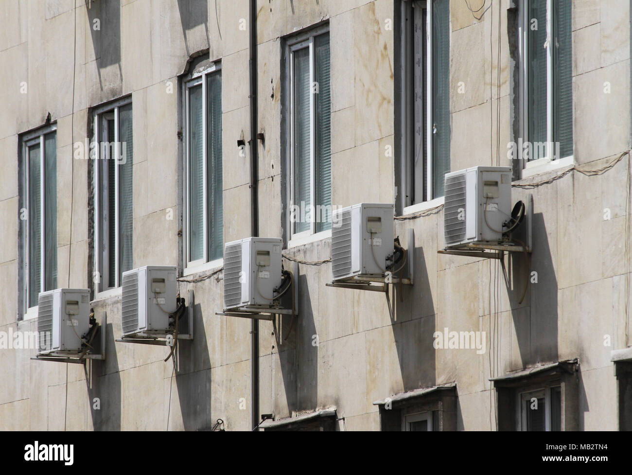 Air conditioner. Air conditioner outside of building above street. Air