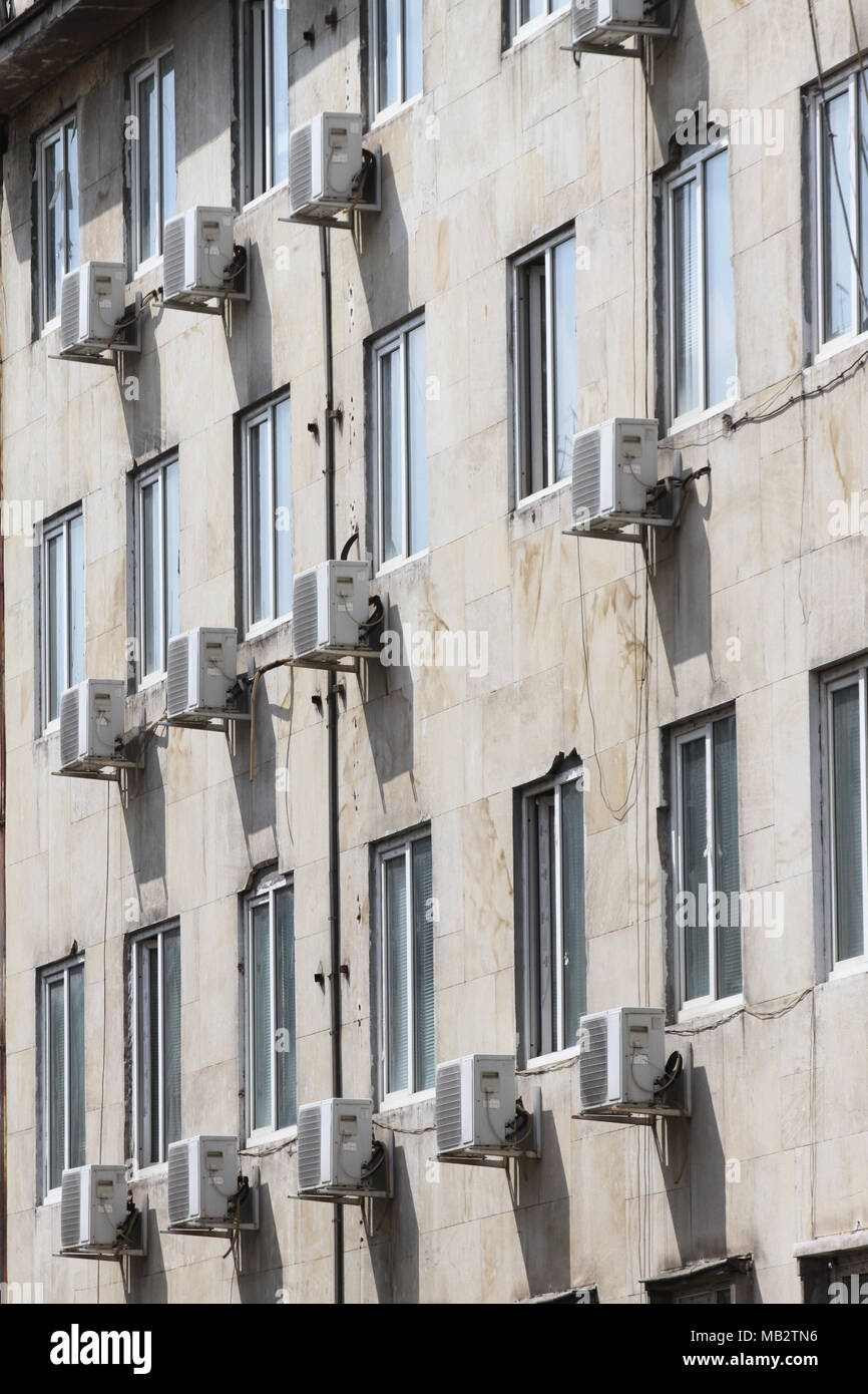 Air conditioner. Air conditioner outside of building above street. Air