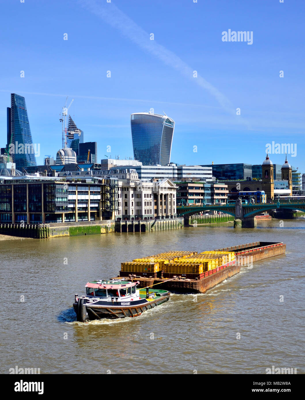 London, England, UK. Thames barge Redoubt towing cargo down the river Thames Stock Photo