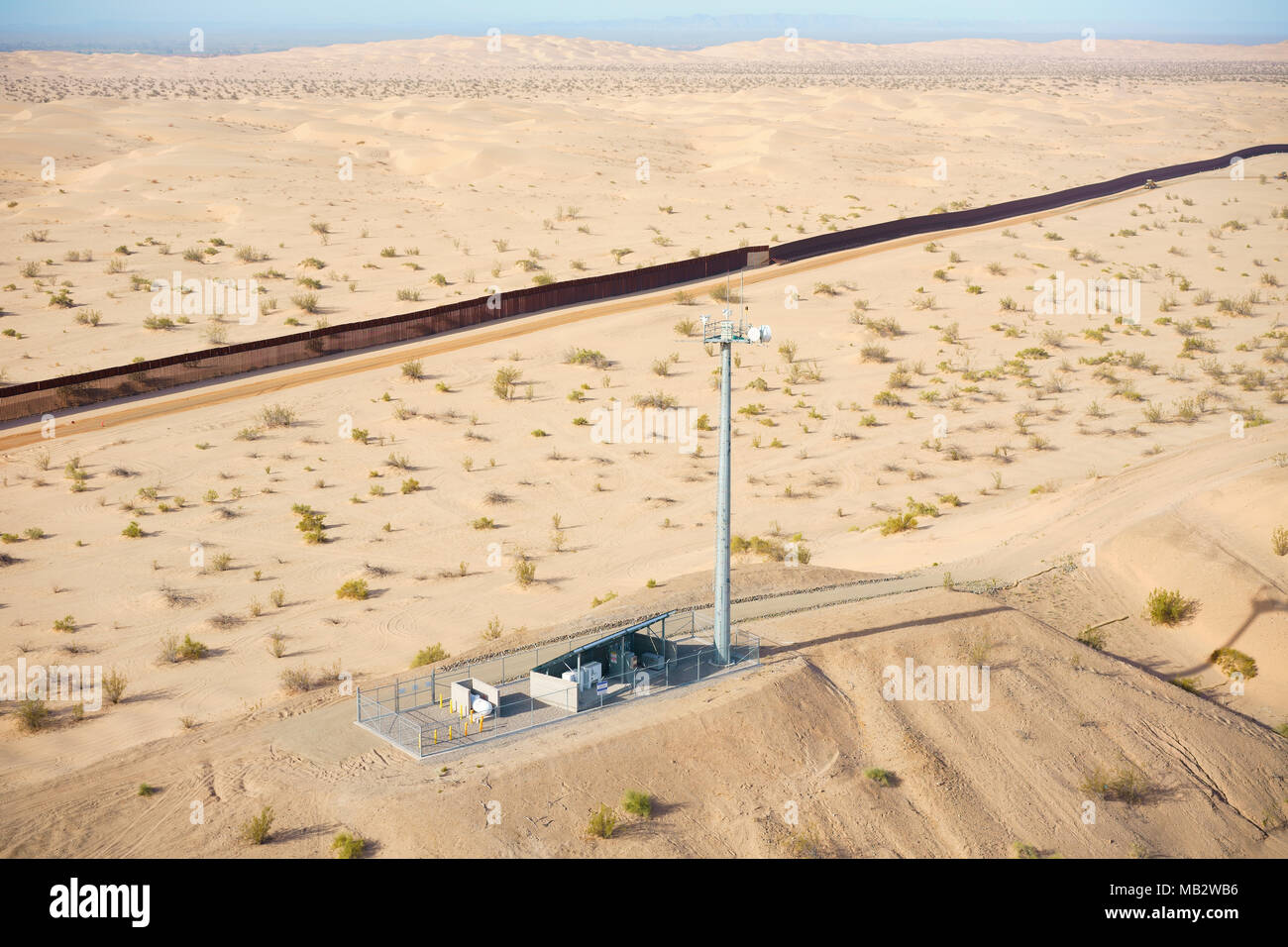 AERIAL VIEW. High-tech equipment on a mound used for surveillance of the Mexico / U.S. border. Algodones Sand Dunes in the Sonoran Desert. Stock Photo